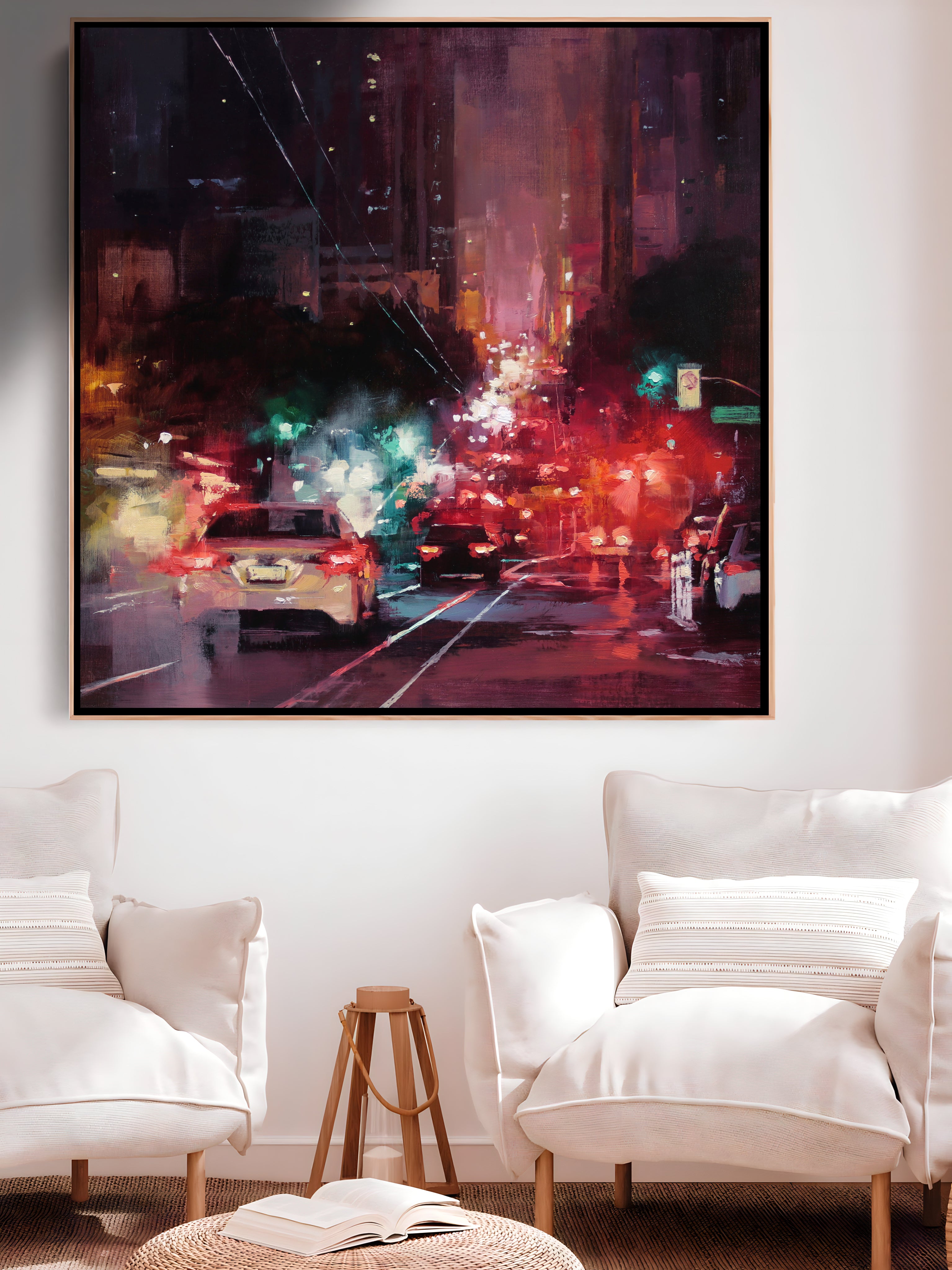 a living room with two white chairs and a painting on the wall