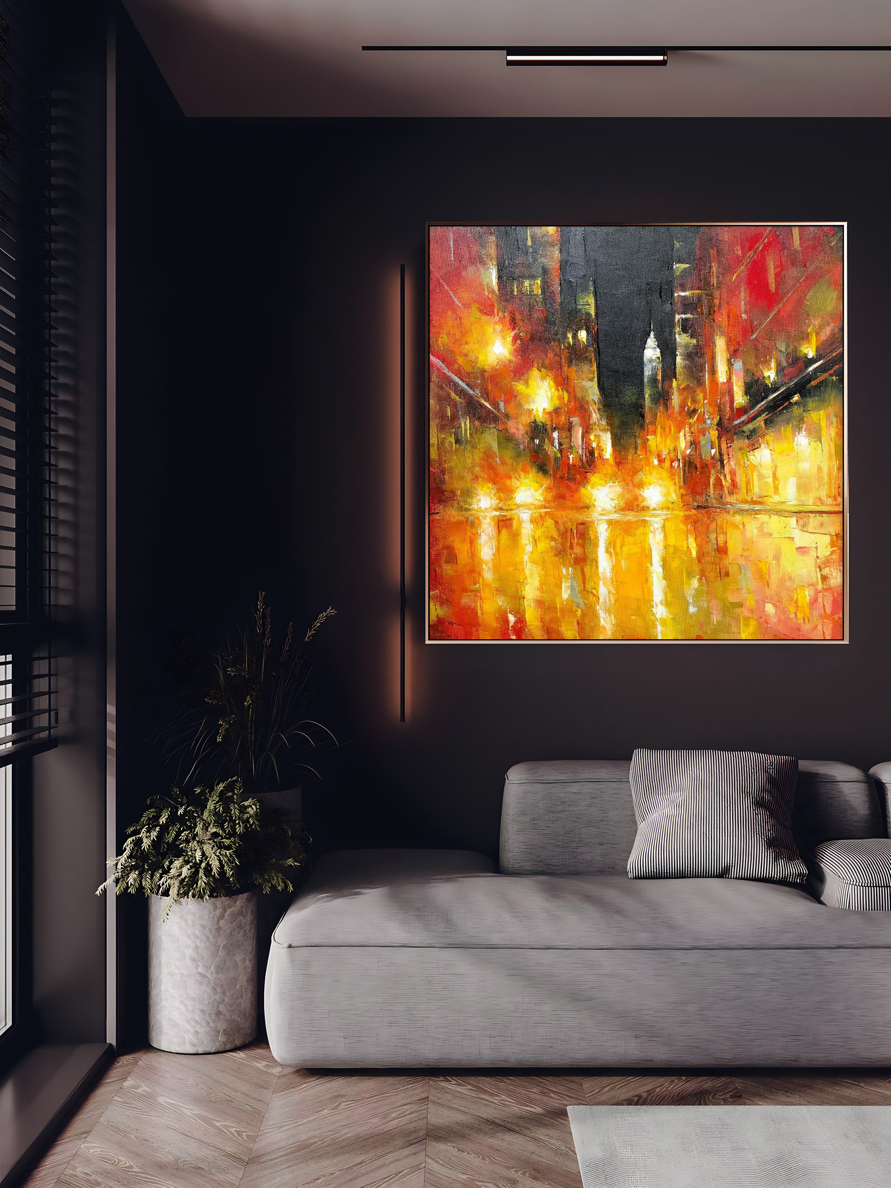 a living room with a couch and a painting on the wall