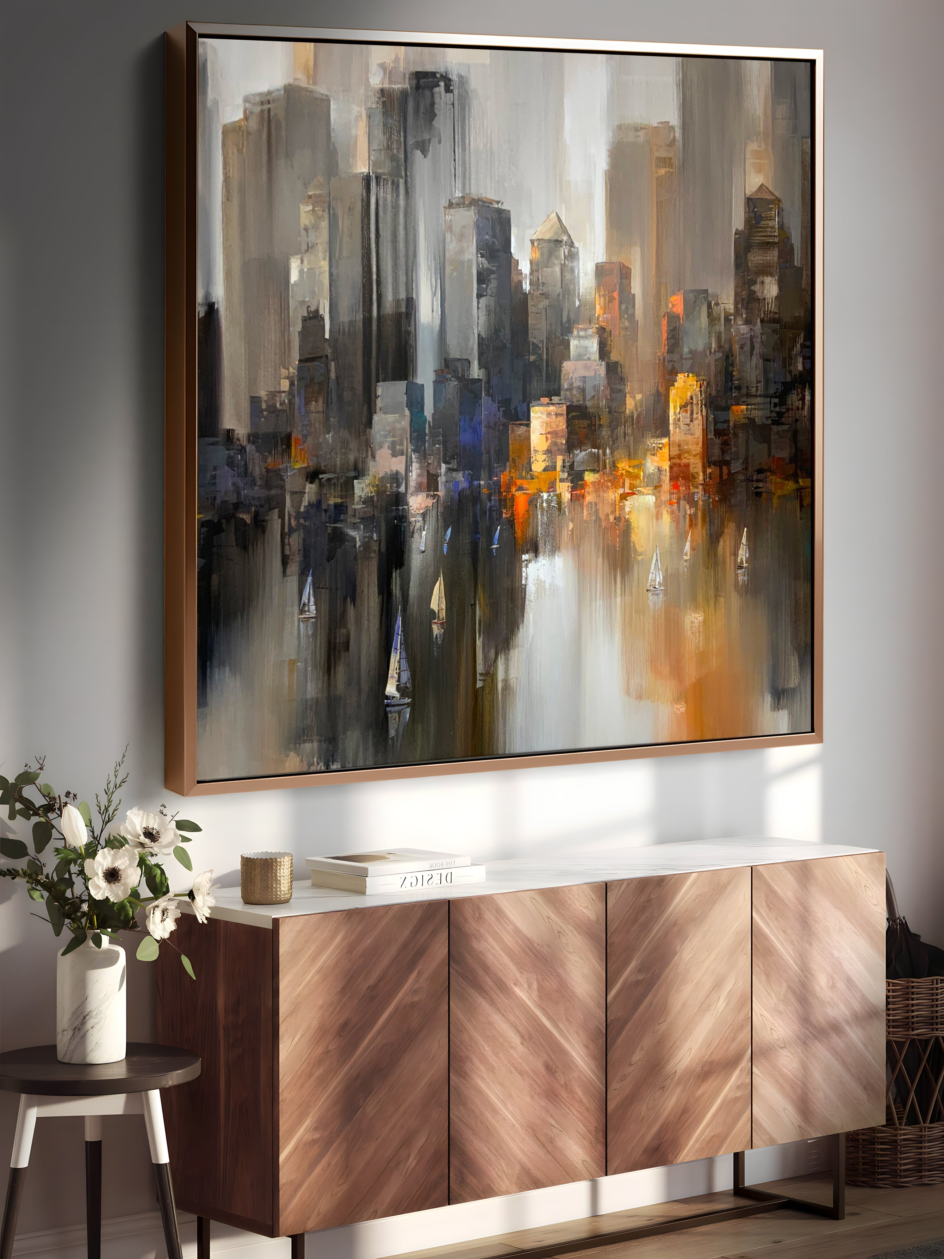a painting hanging on a wall above a sideboard