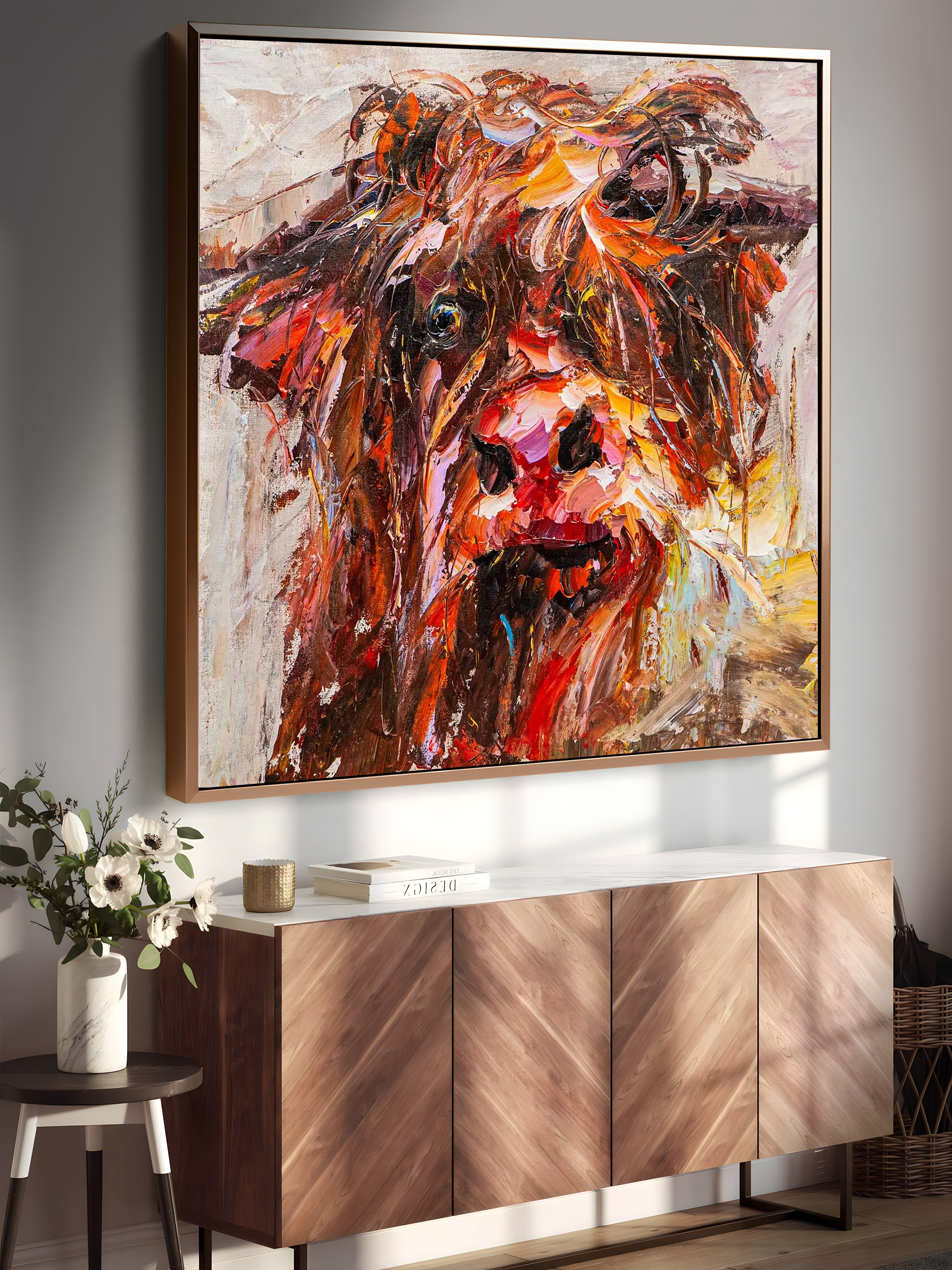 a painting of a cow is hanging on a wall