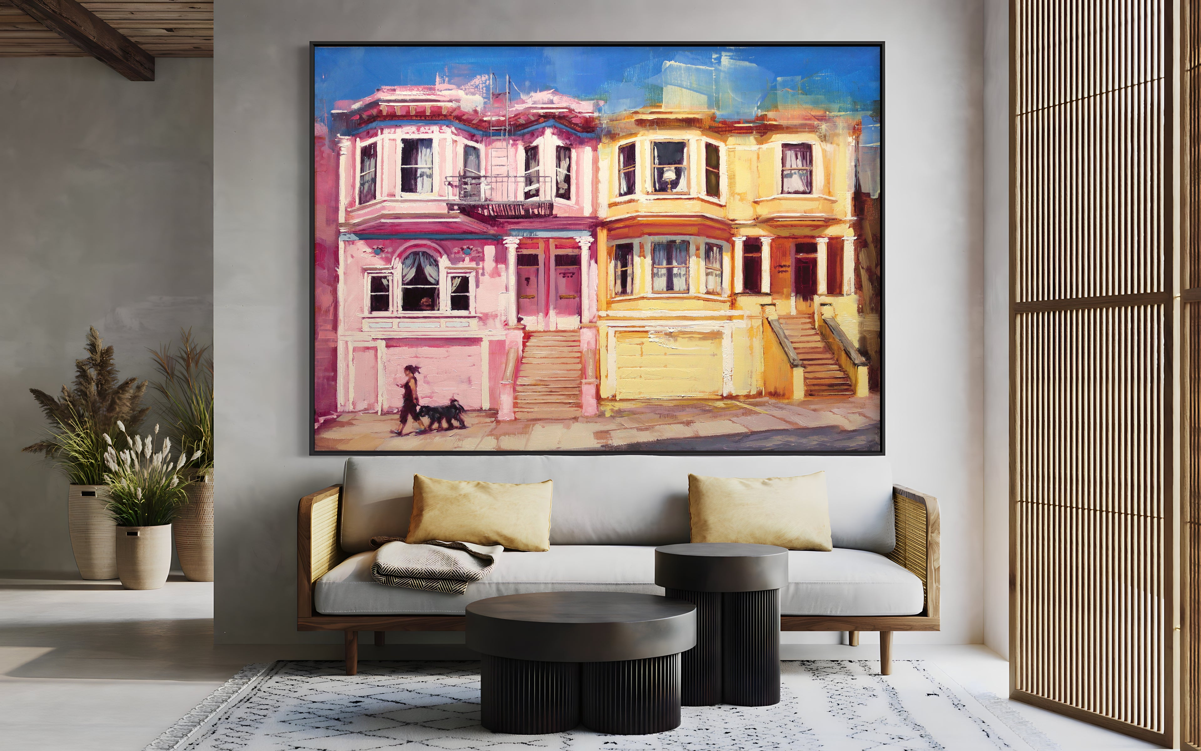 a living room with a couch and a painting on the wall