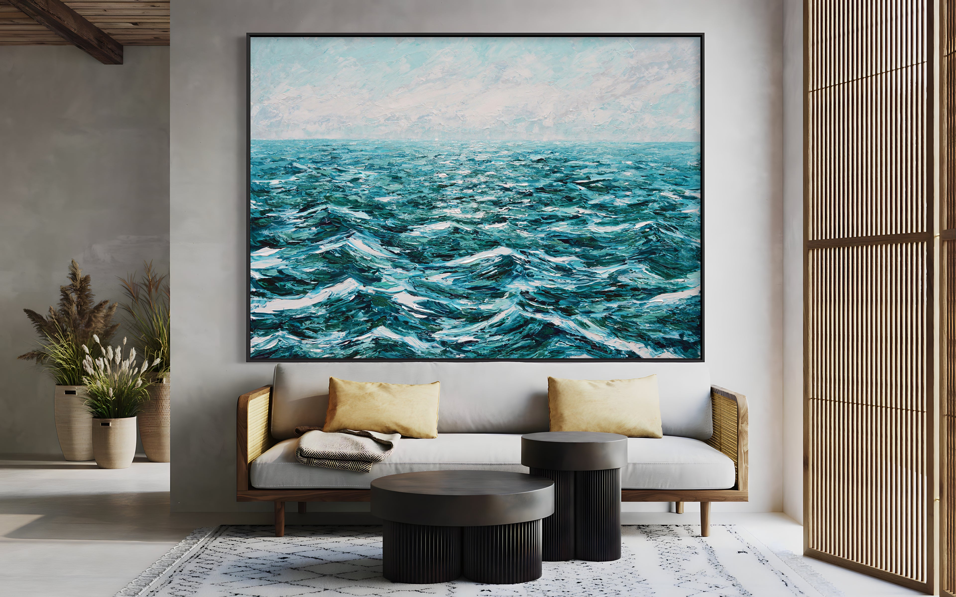 a living room with a couch and a painting on the wall