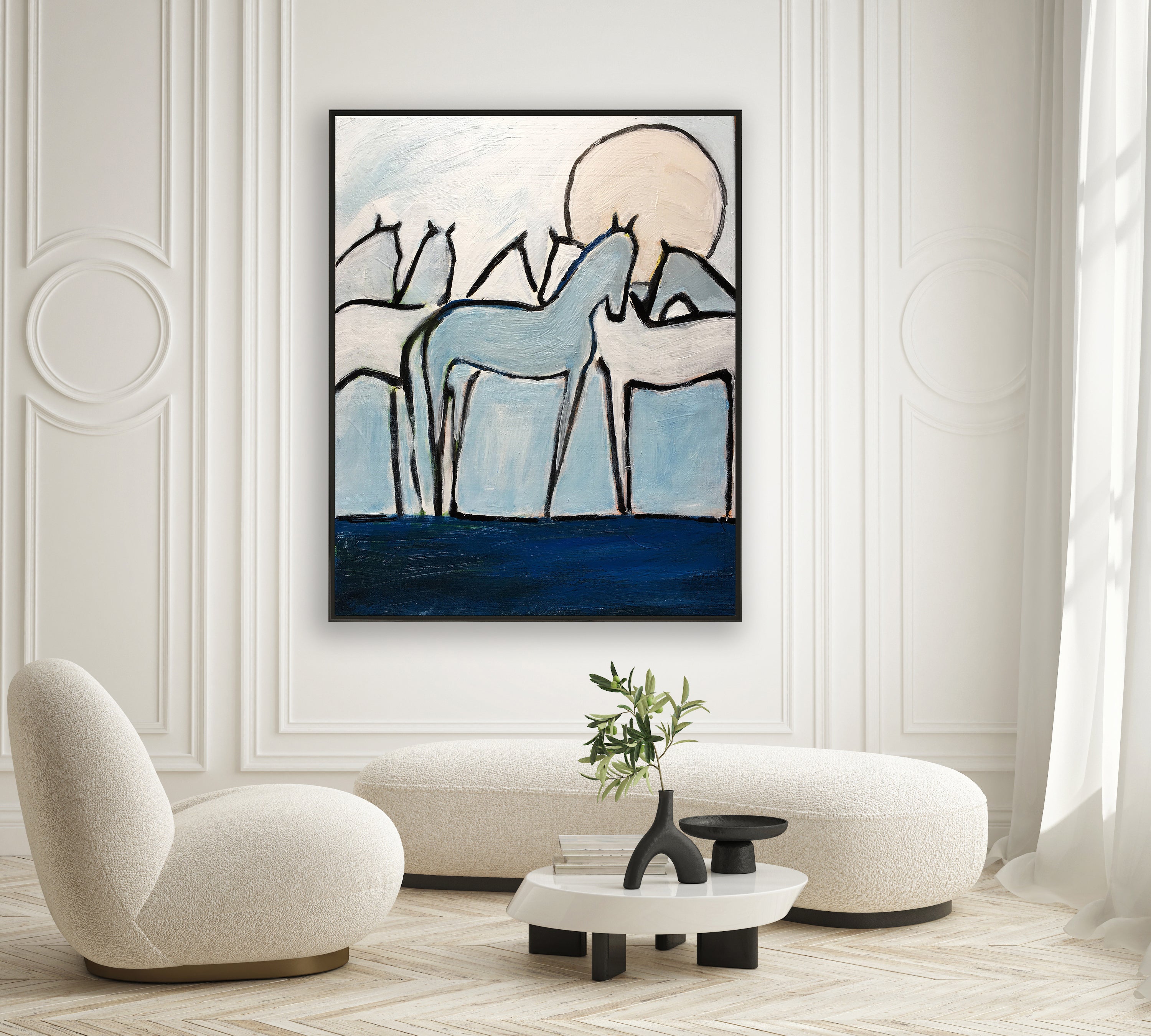 a living room with a painting on the wall