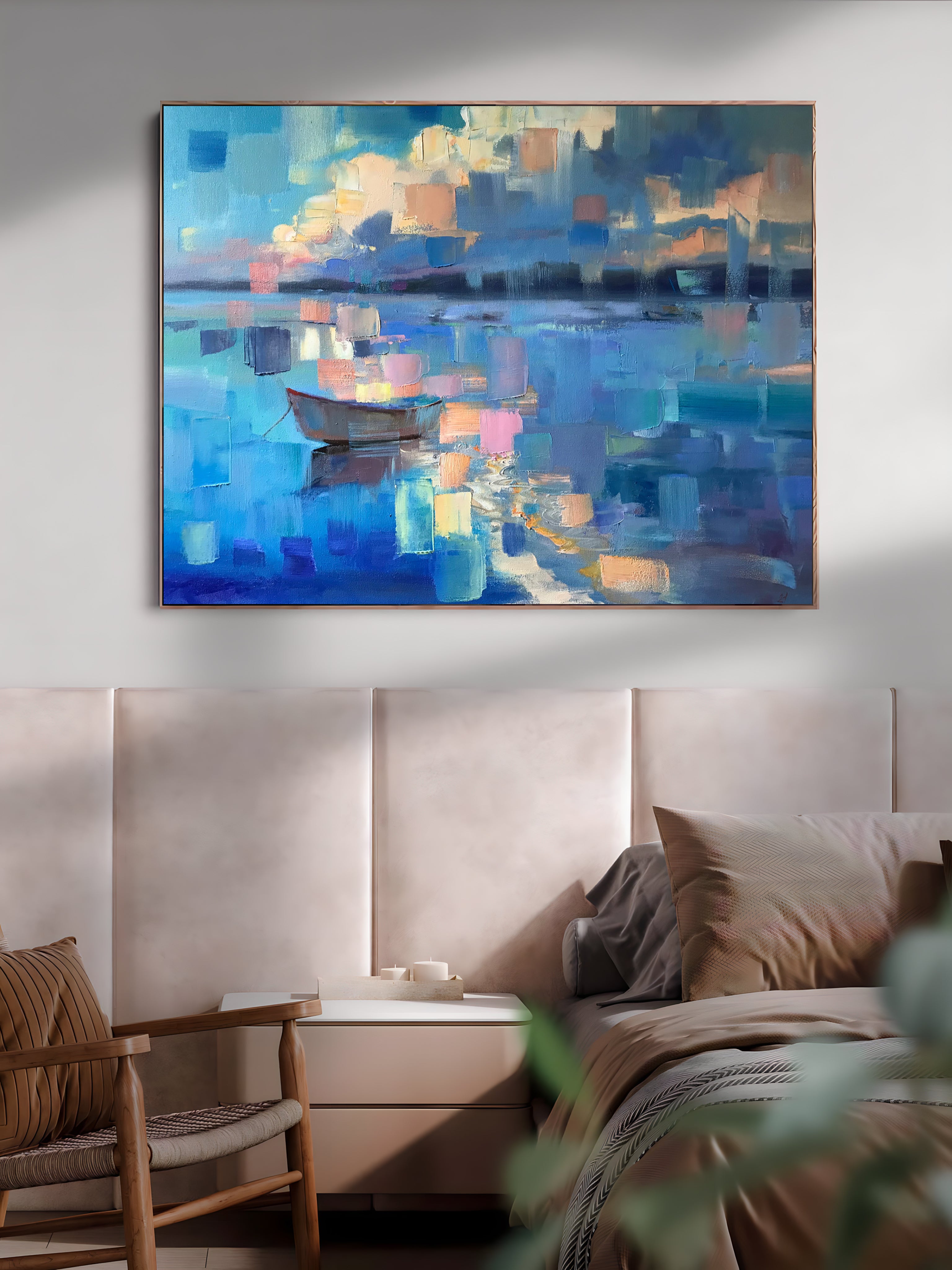 a painting hanging on a wall above a bed