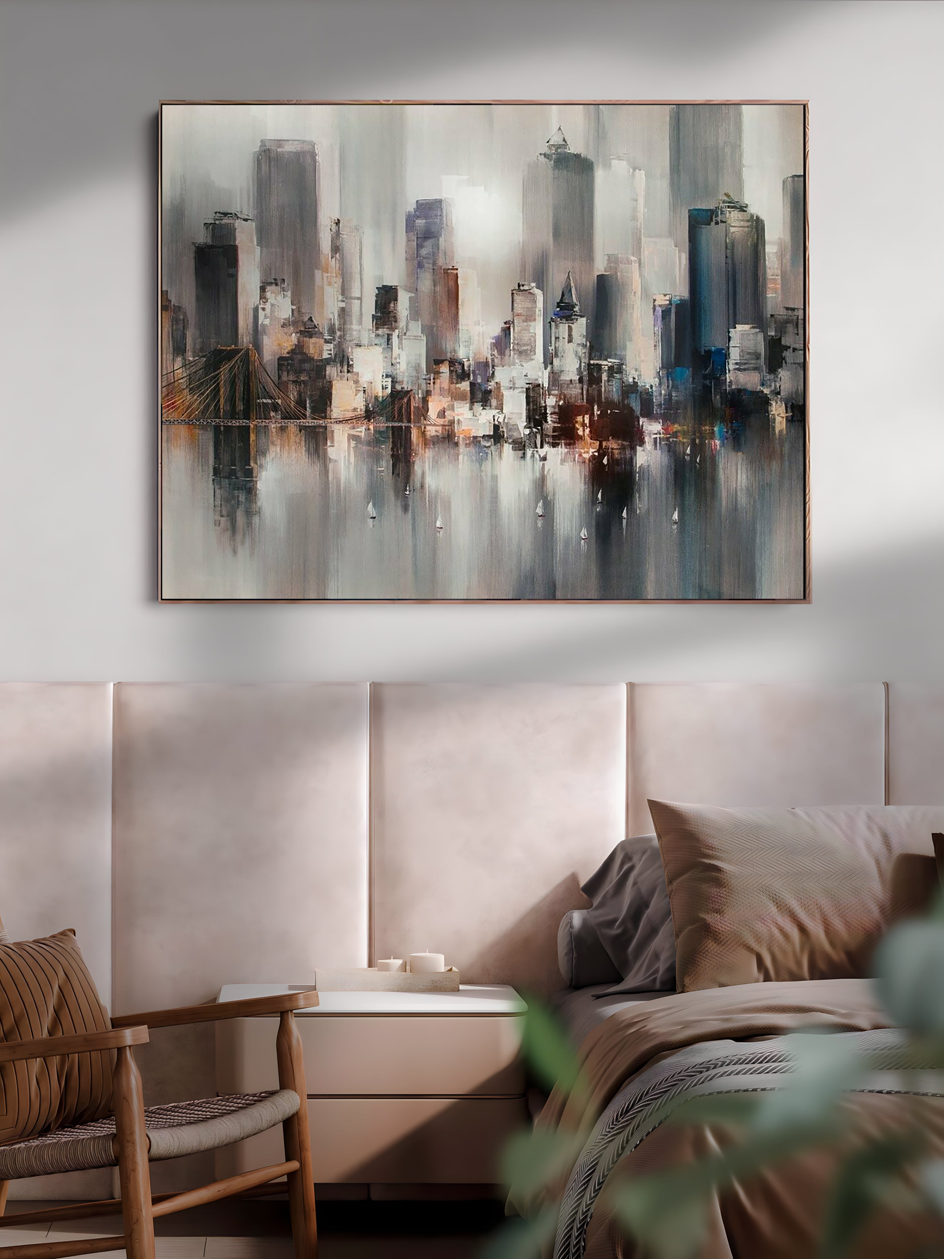 a painting of a cityscape hangs above a bed