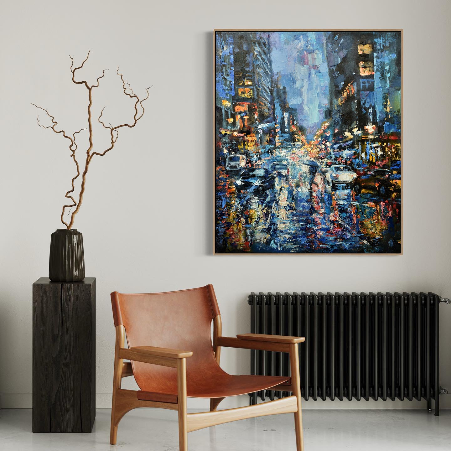 a painting hanging on a wall next to a chair