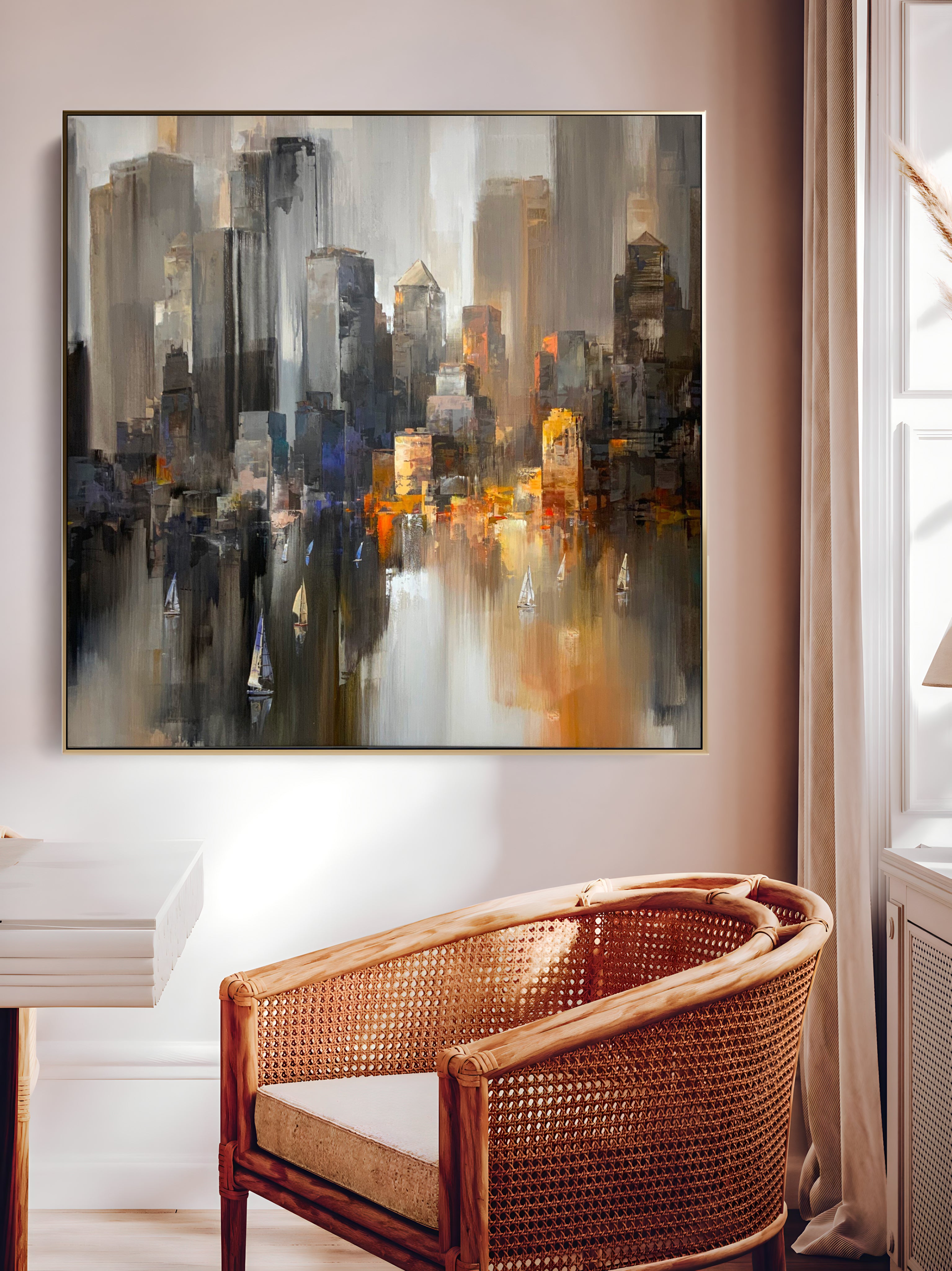 a painting hanging on a wall above a chair