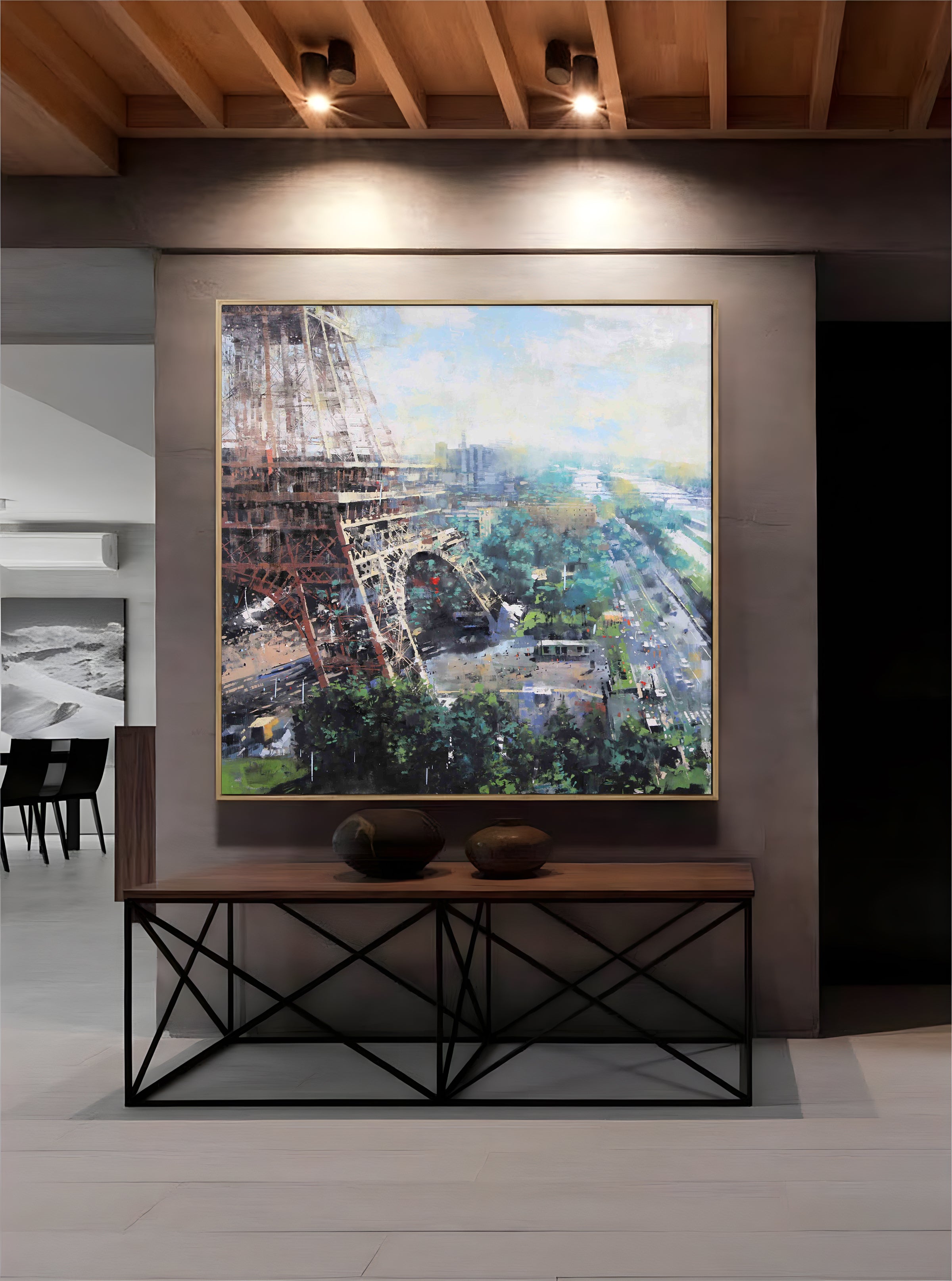 a painting of the eiffel tower hangs on the wall
