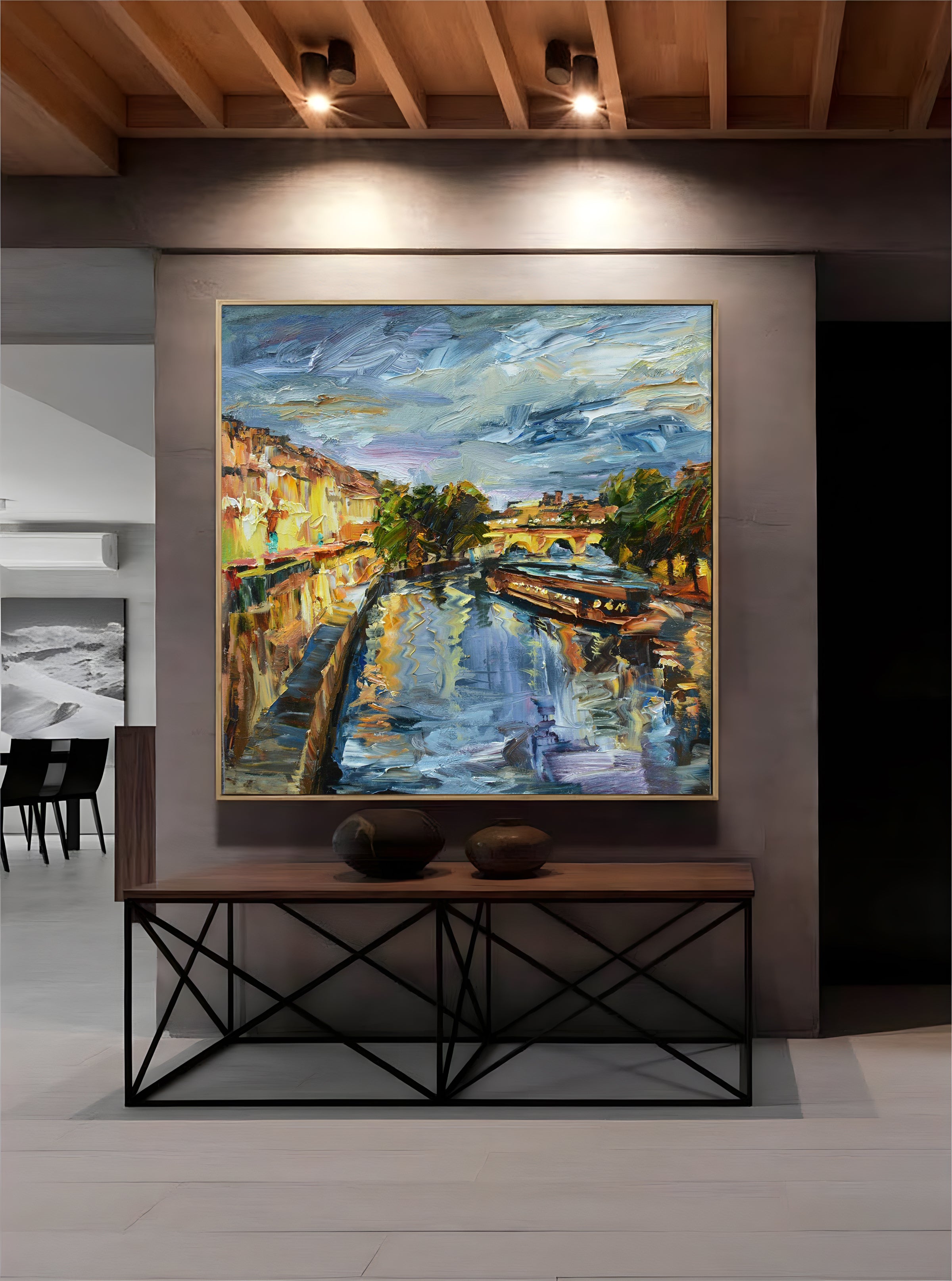 a painting hanging on a wall in a room