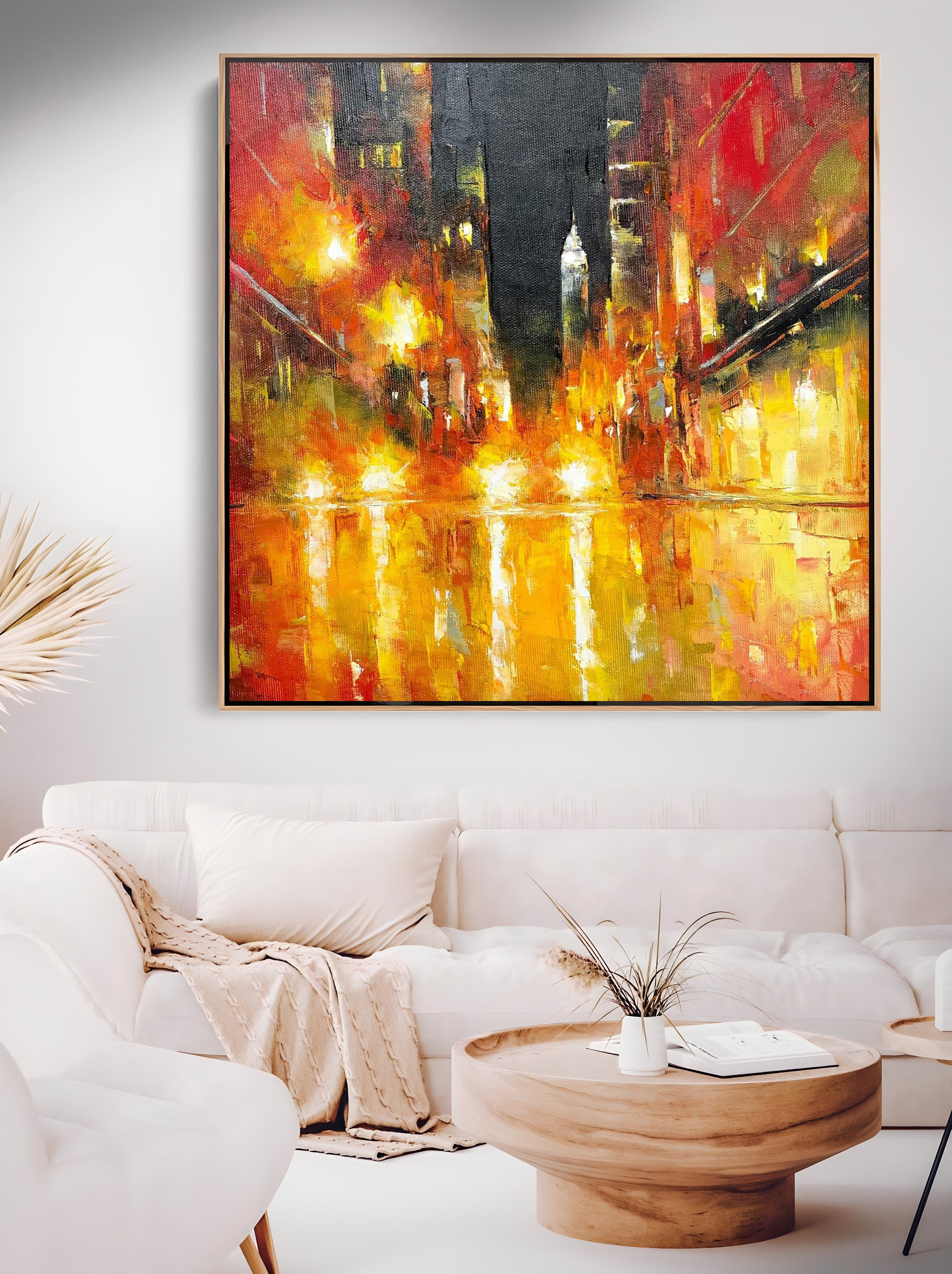 a living room with a large painting on the wall