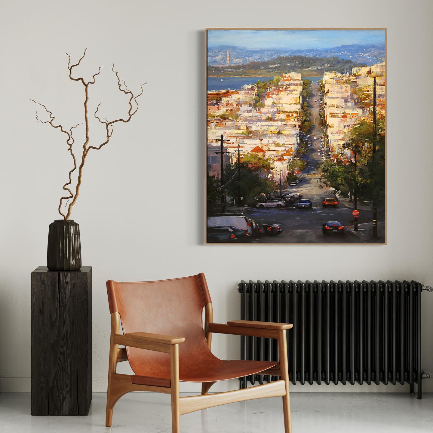 a painting of a cityscape is hanging on a wall