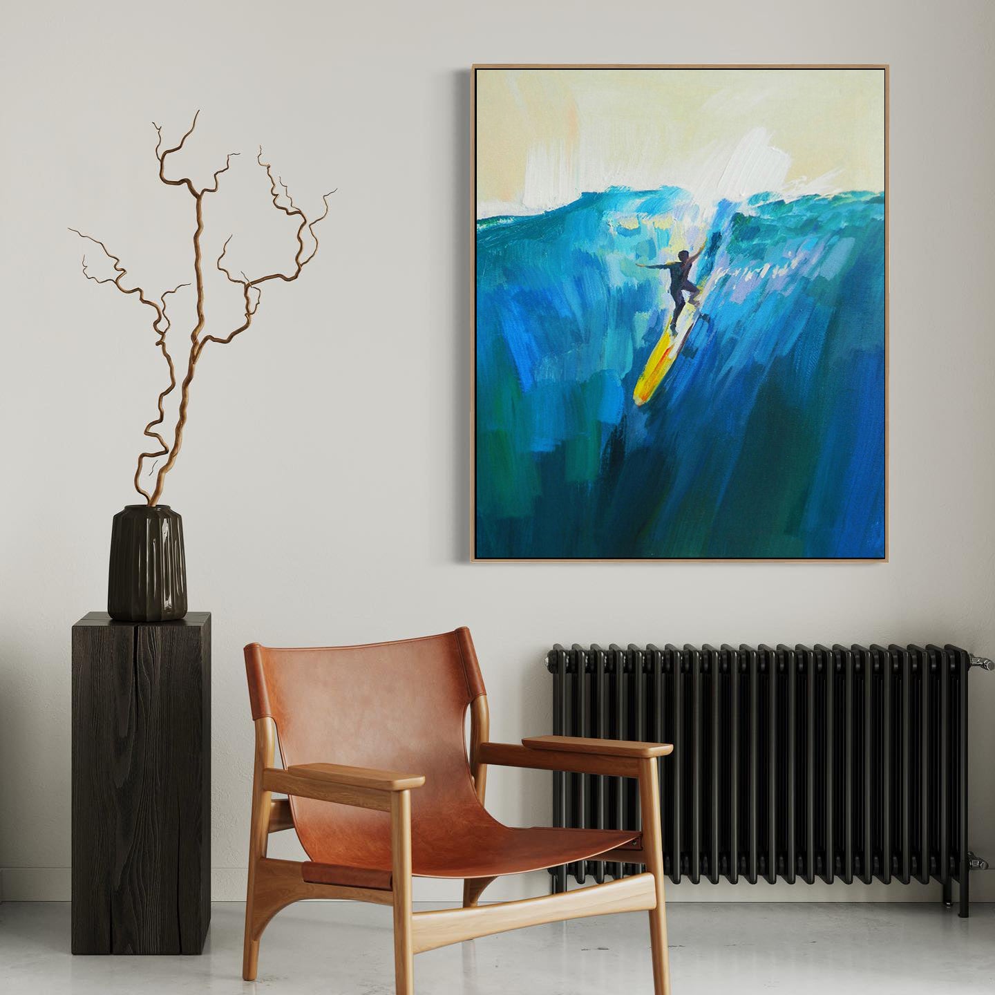 a living room with a chair and a painting on the wall