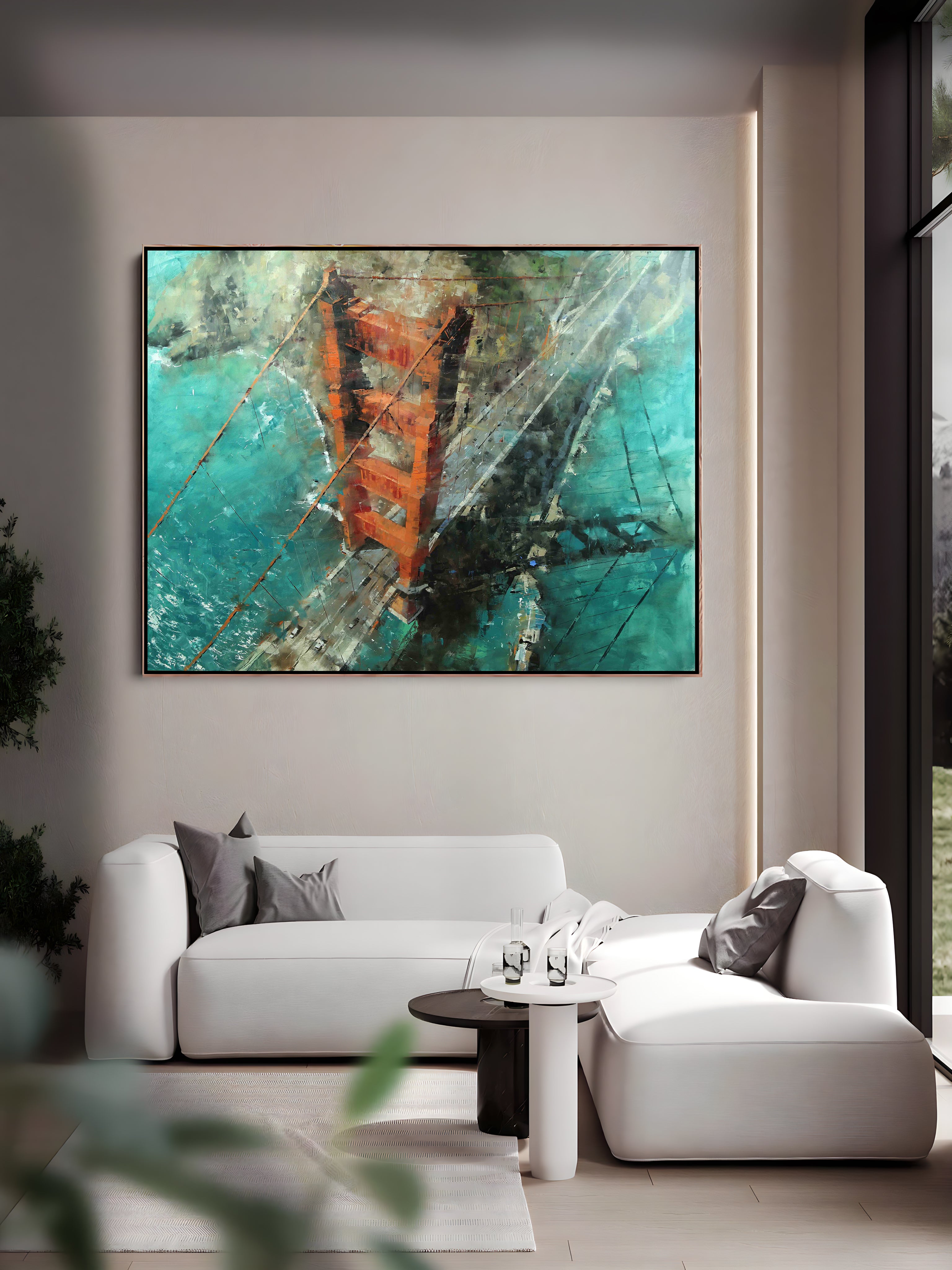 a living room with a white couch and a painting on the wall