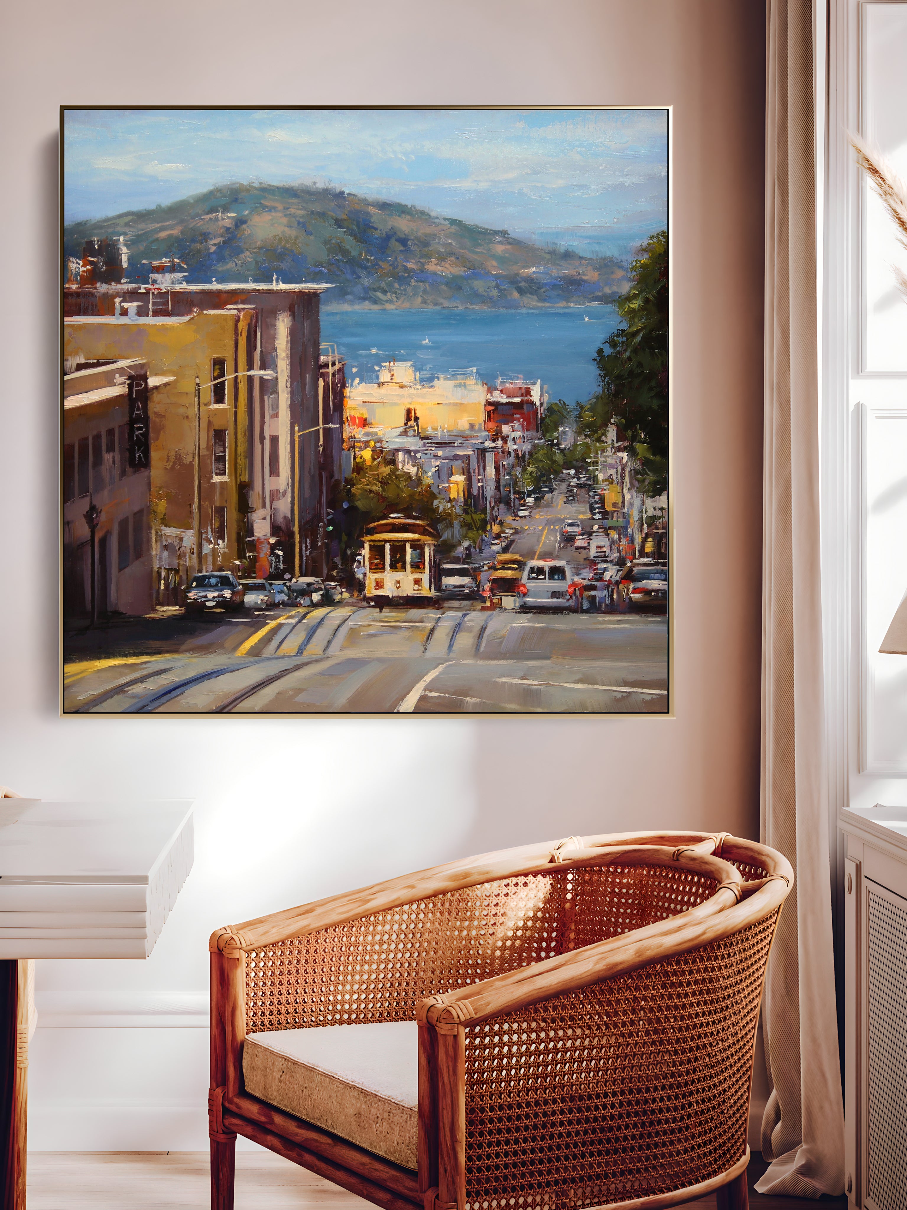 a painting hanging on a wall above a chair