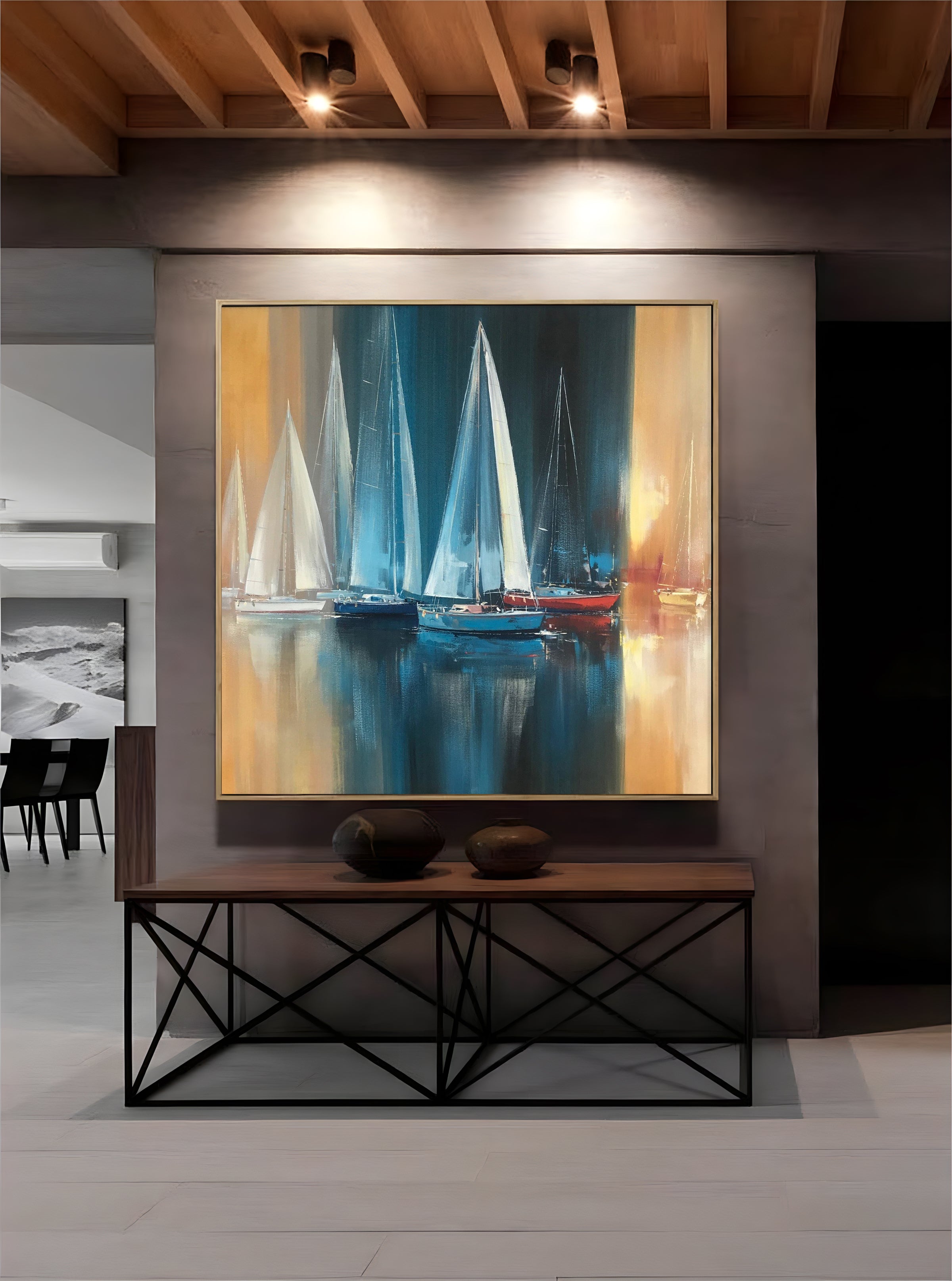 a painting of sailboats on display in a room