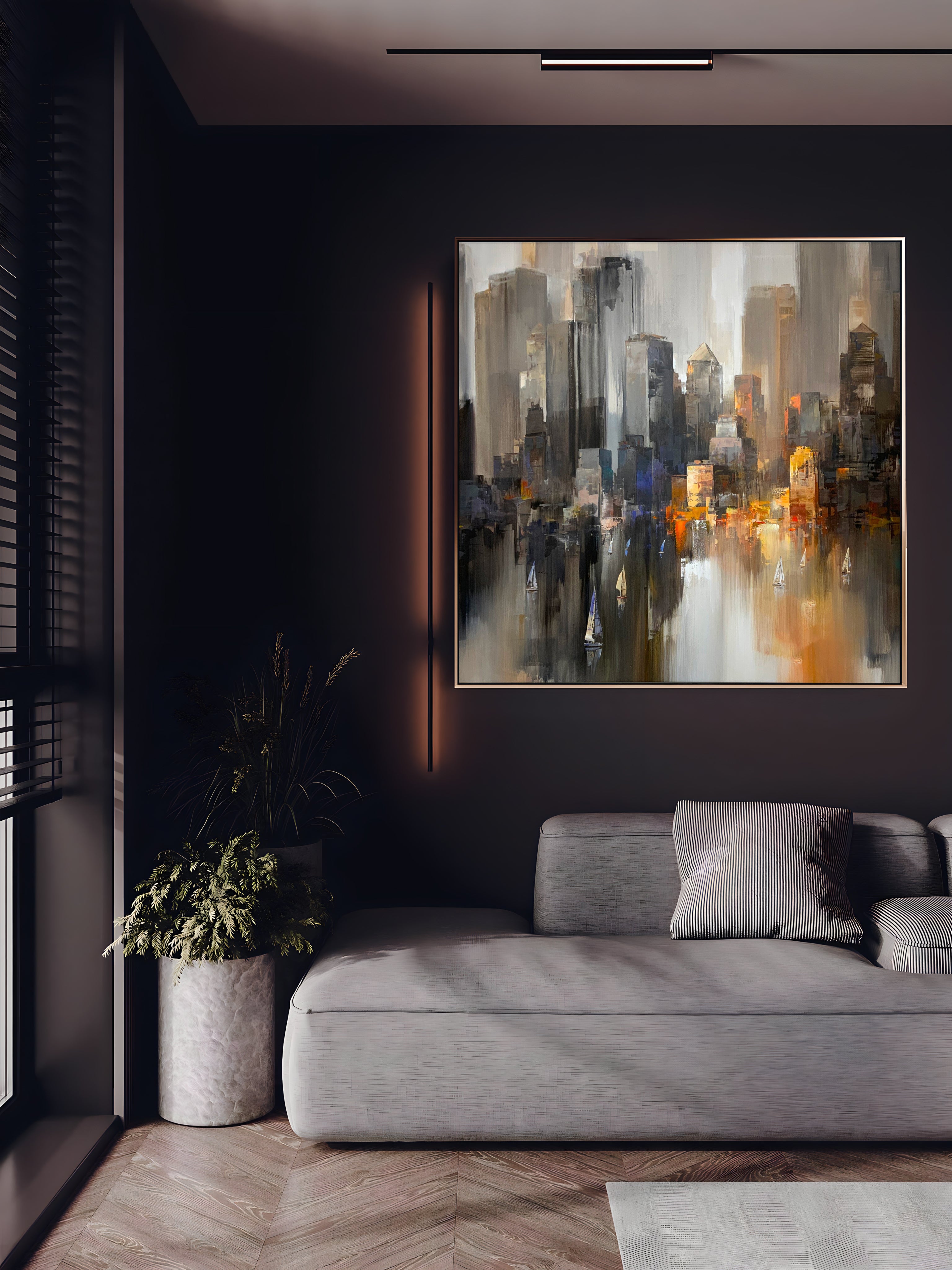 a living room with a couch and a painting on the wall