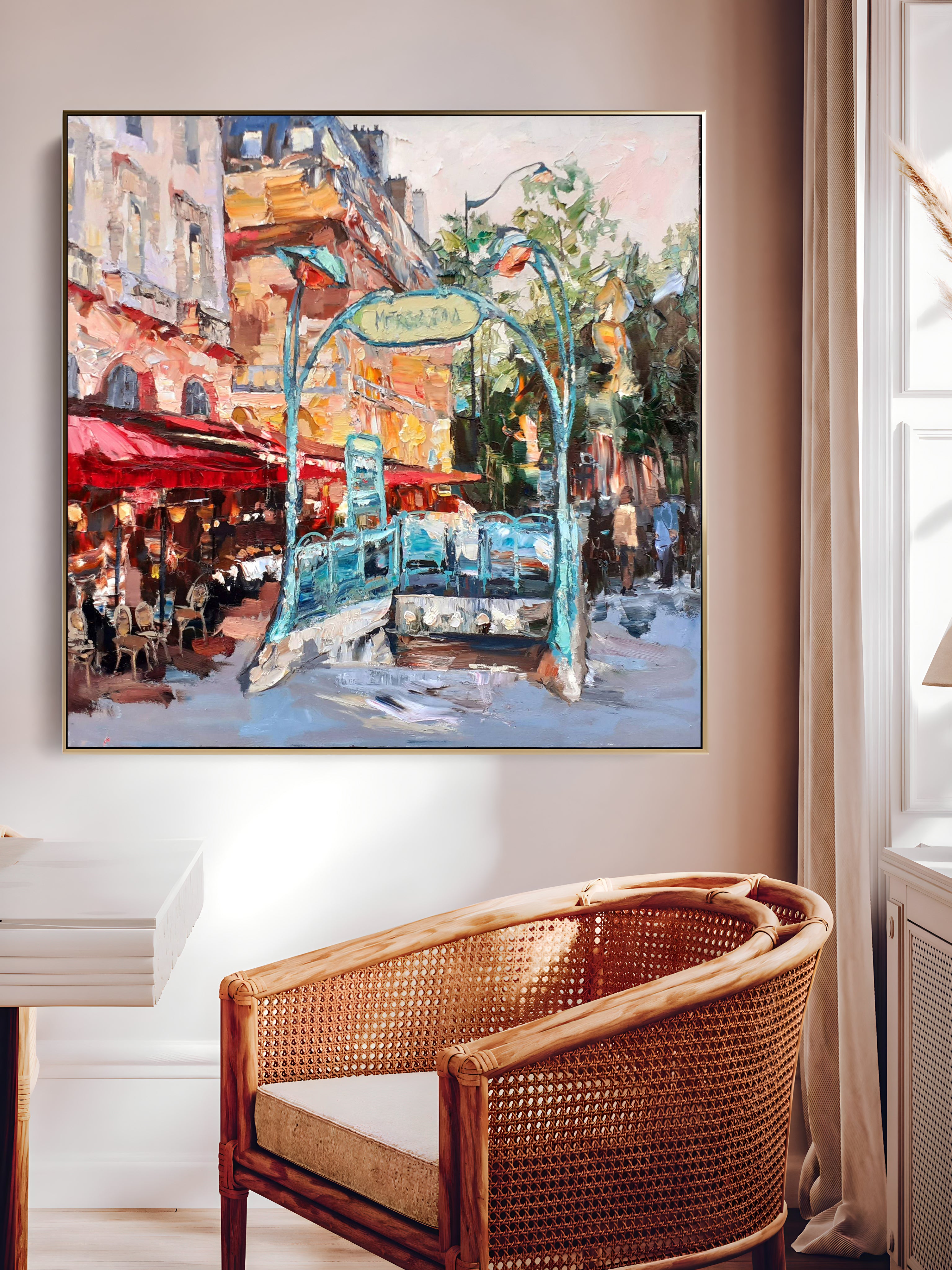 a painting hanging on a wall next to a chair