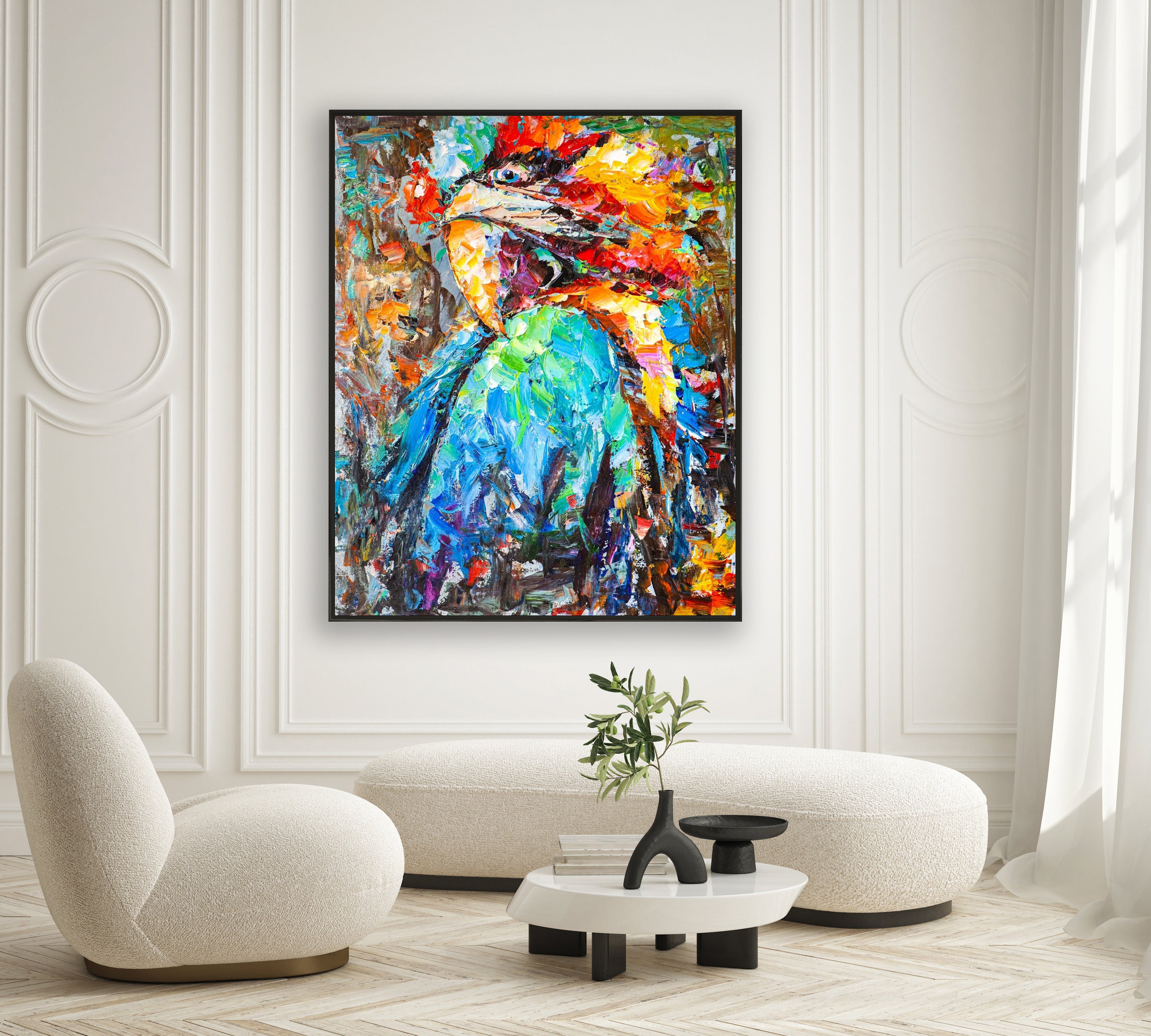 a living room with a painting on the wall