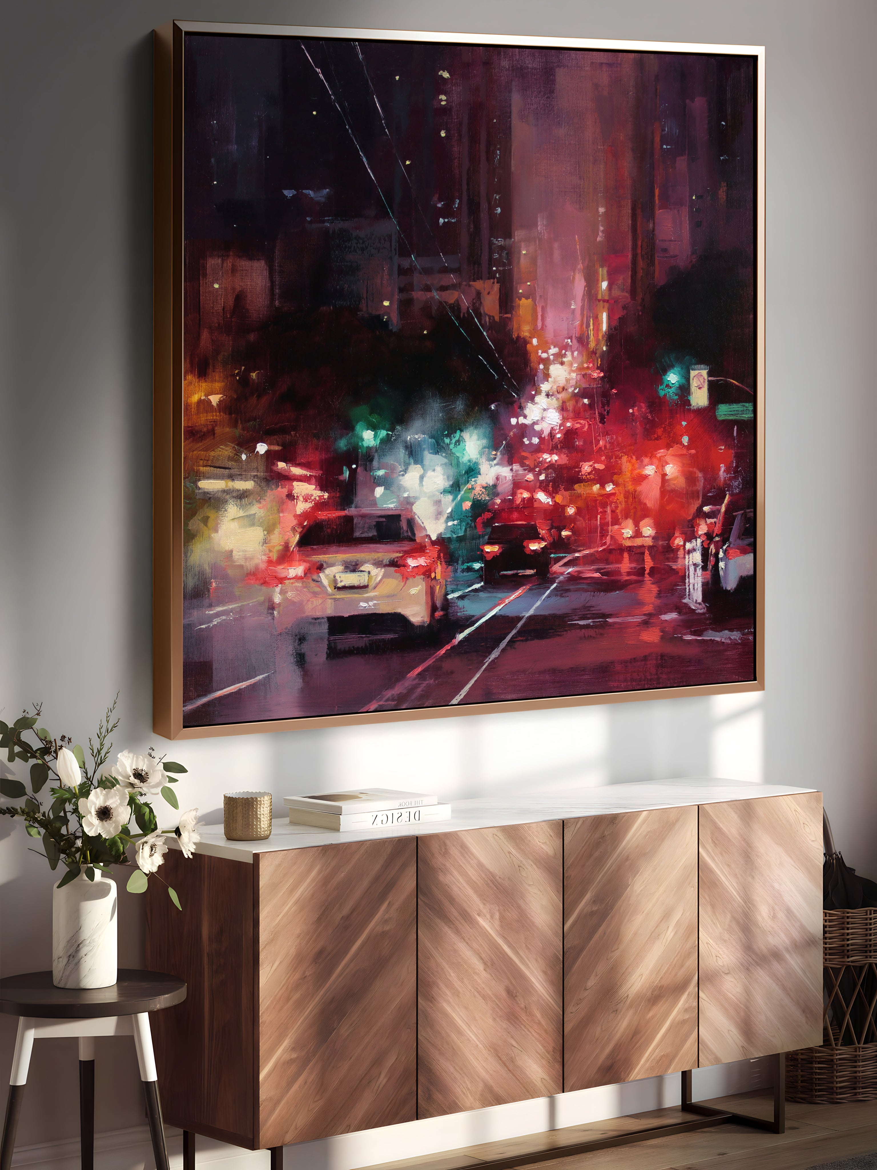 a painting hanging on a wall next to a sideboard