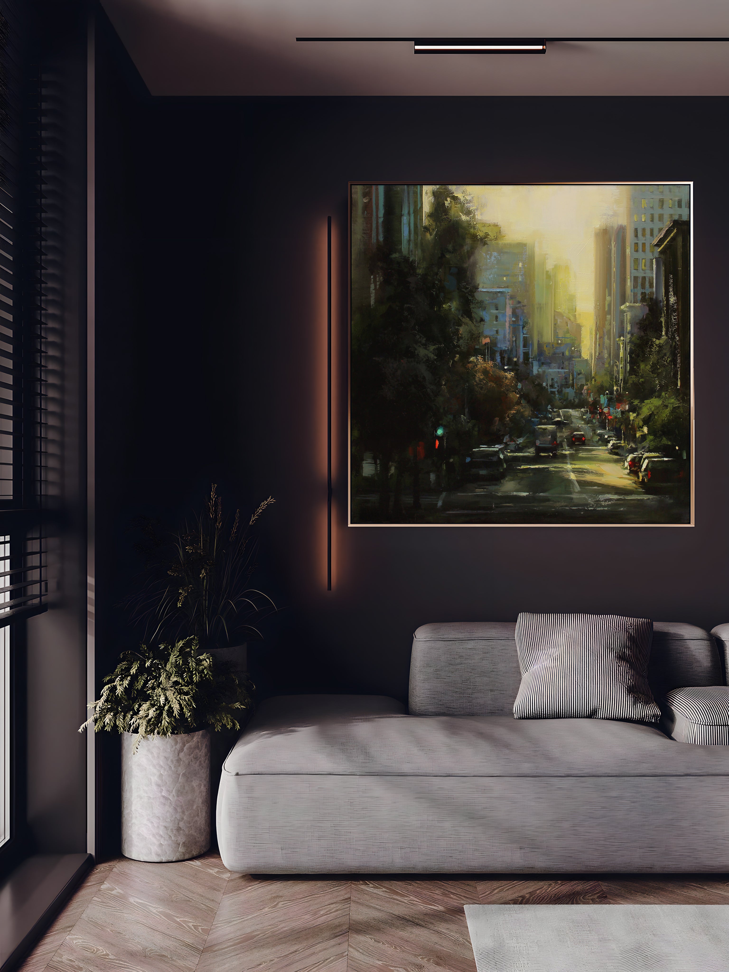 a living room with a couch and a painting on the wall