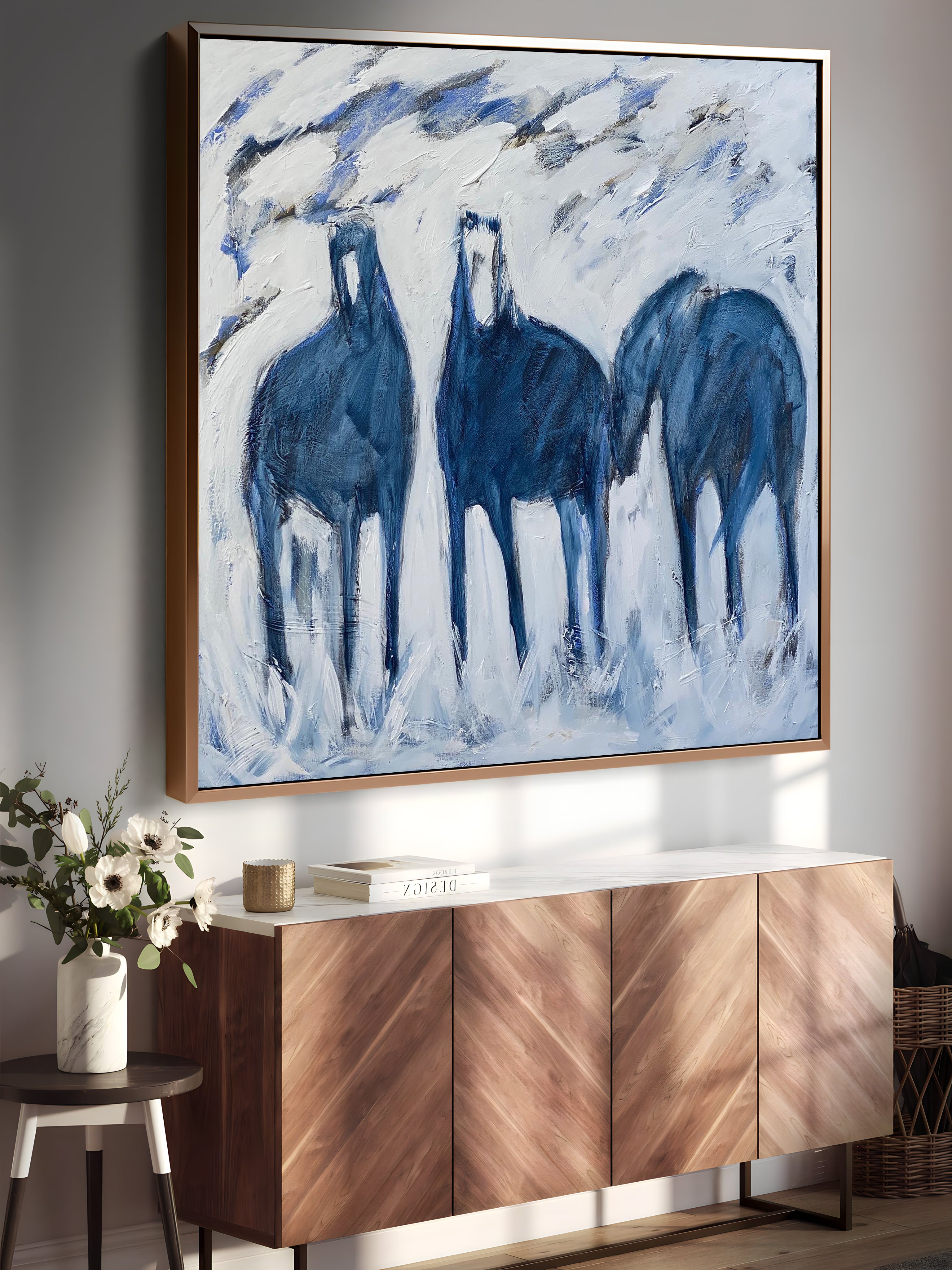 a painting of three blue horses on a wall