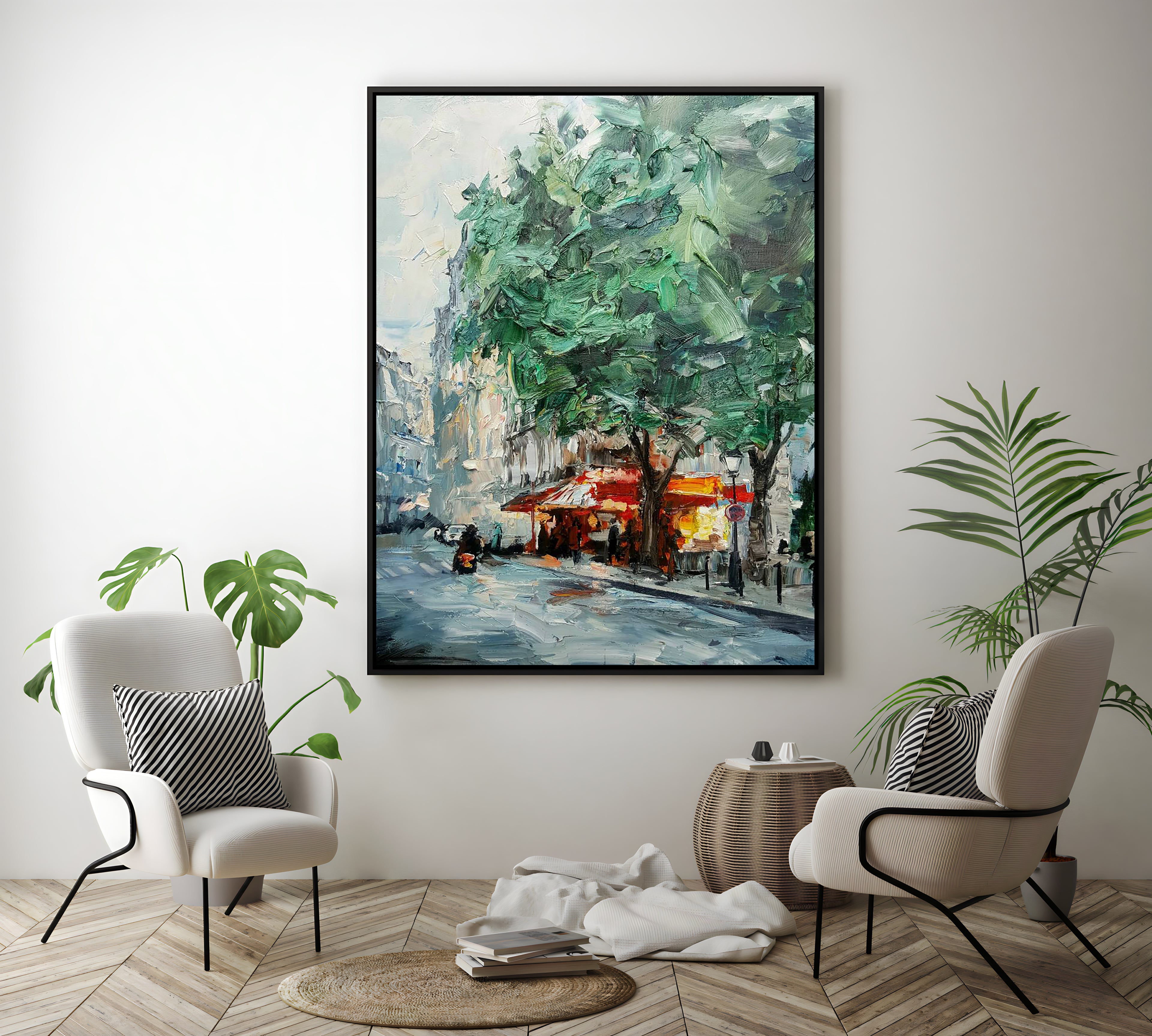 a room with two chairs and a painting on the wall