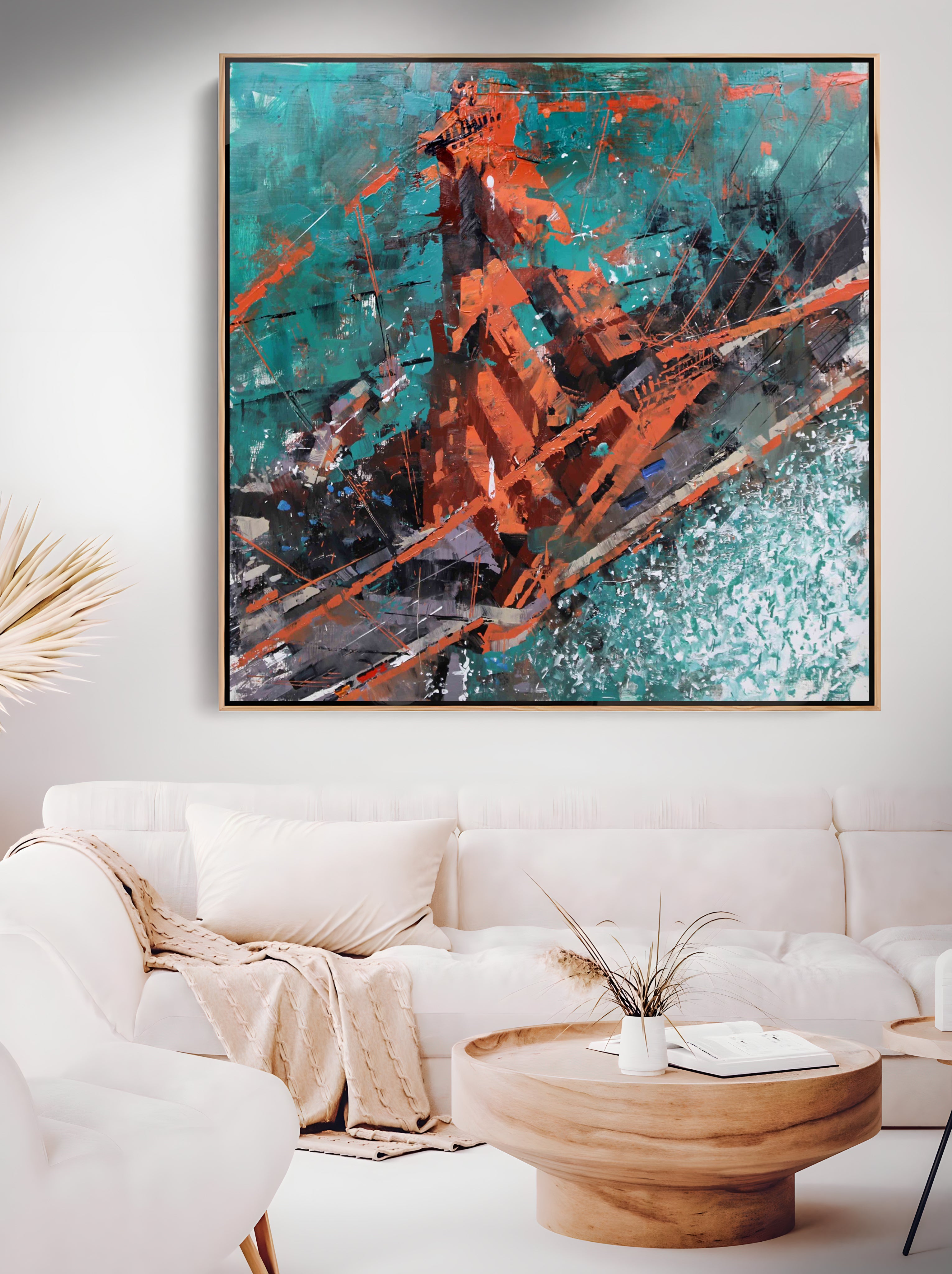 a living room with a white couch and a painting on the wall