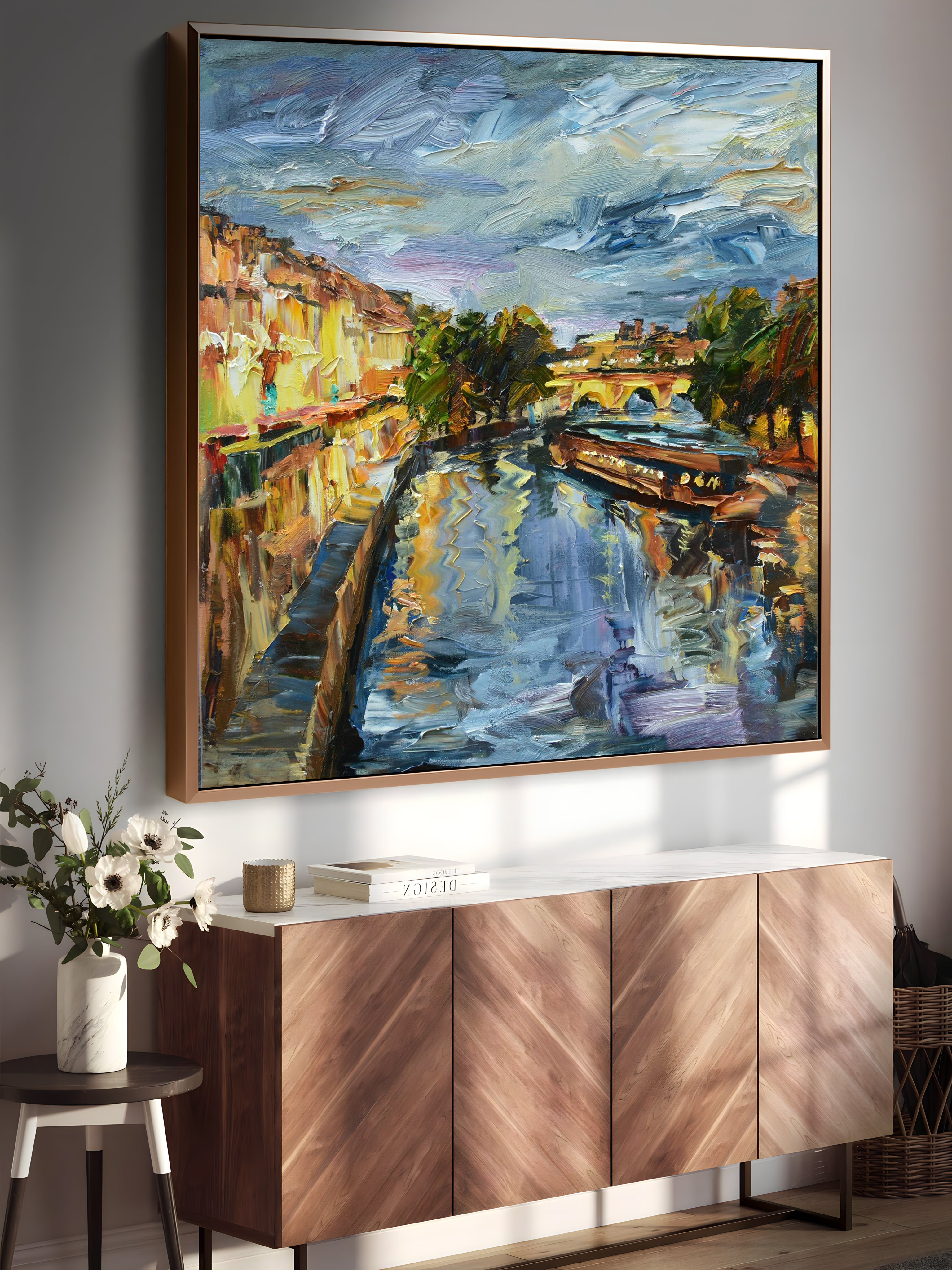 a painting hanging on a wall next to a sideboard