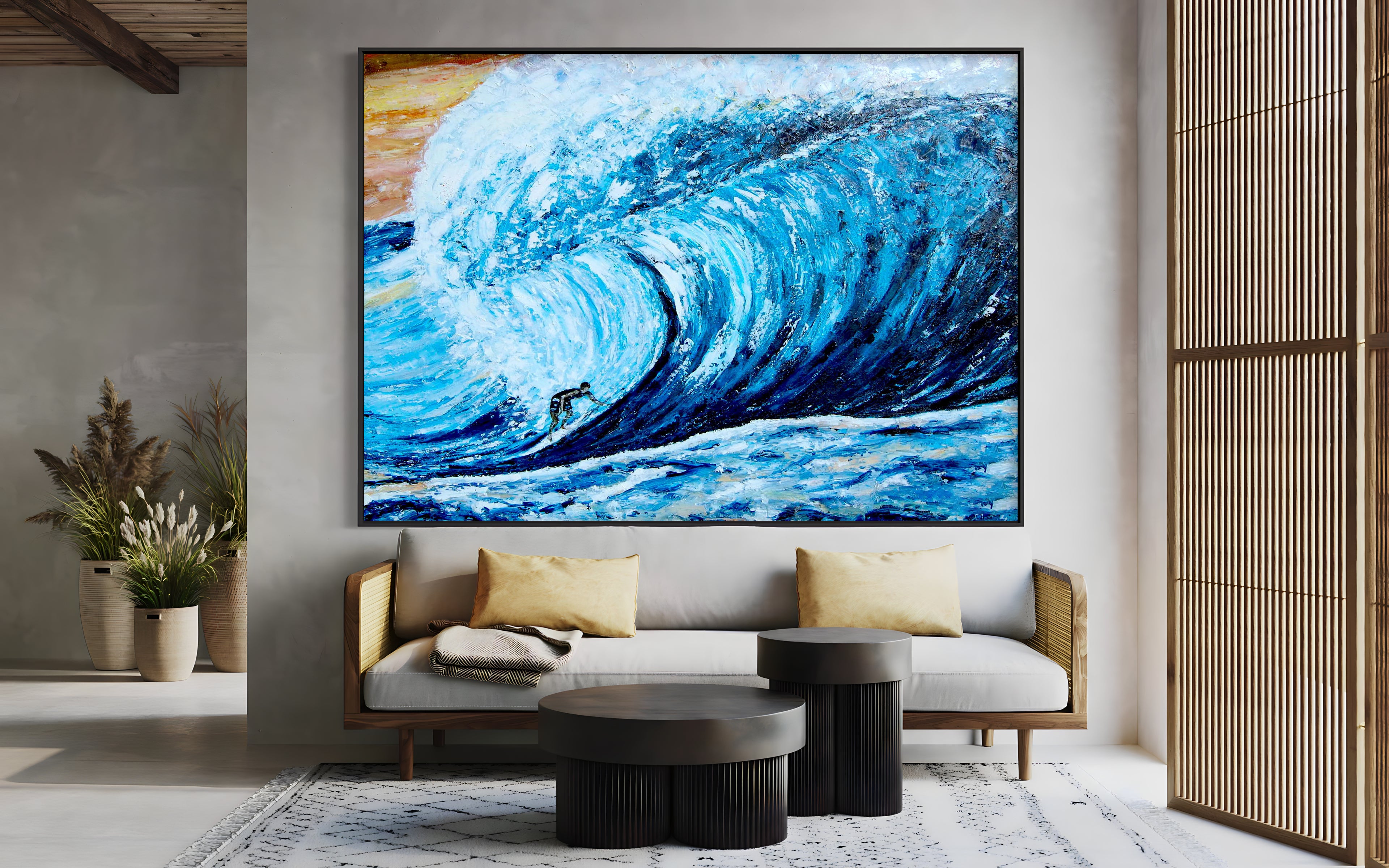 a living room with a couch and a painting on the wall