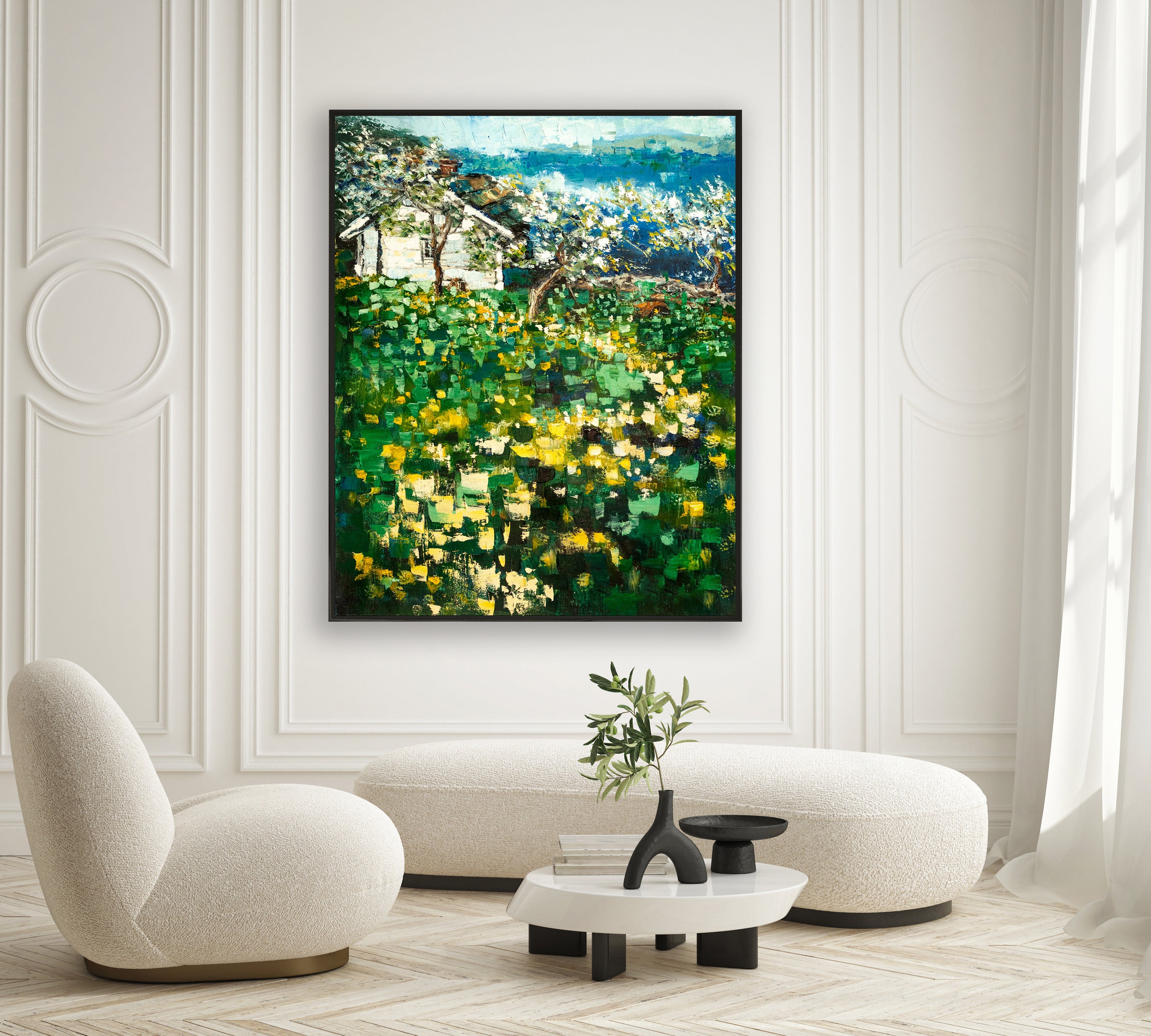 a living room with a painting on the wall