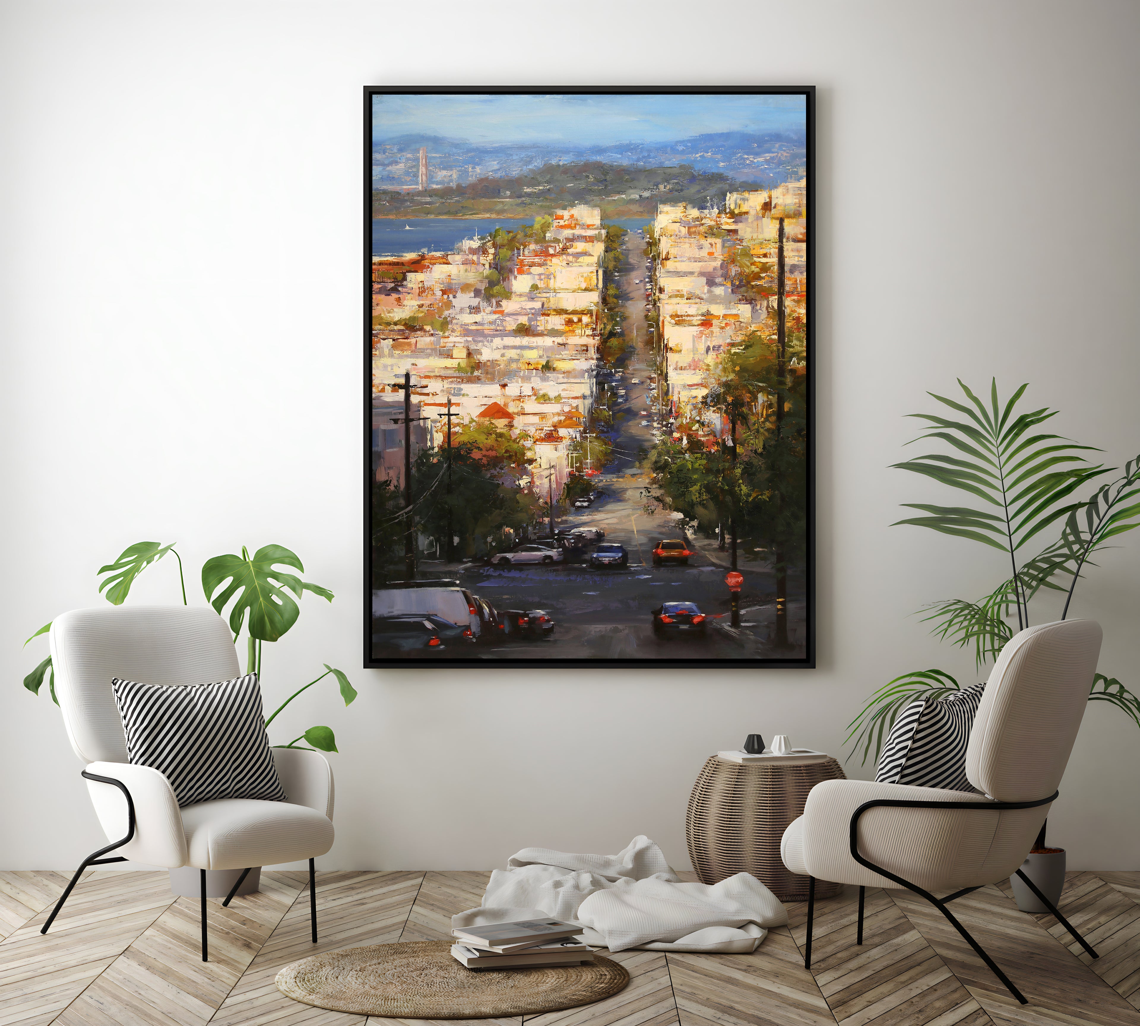 a painting of a cityscape is hanging on a wall