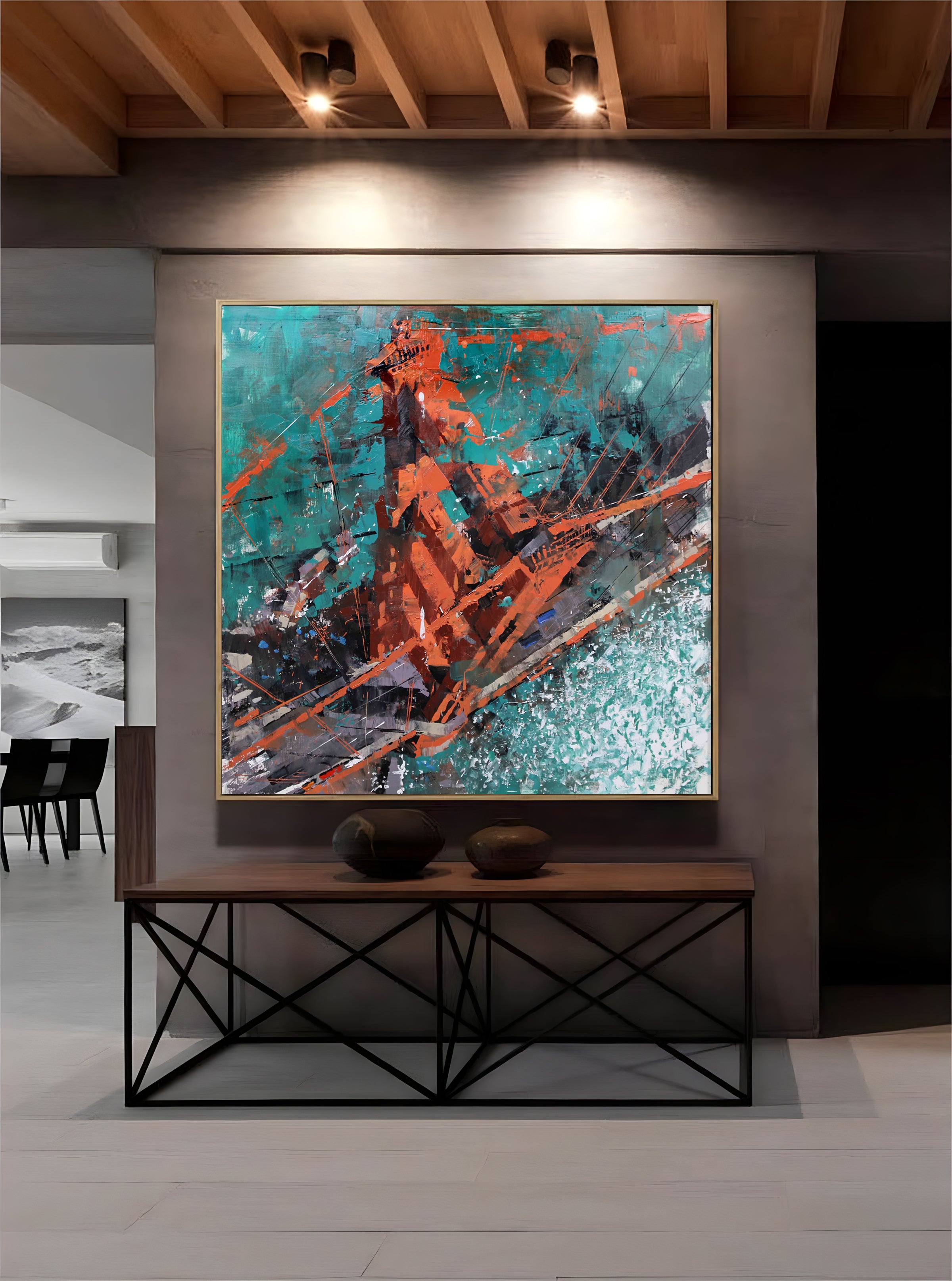 a painting hanging on a wall in a room