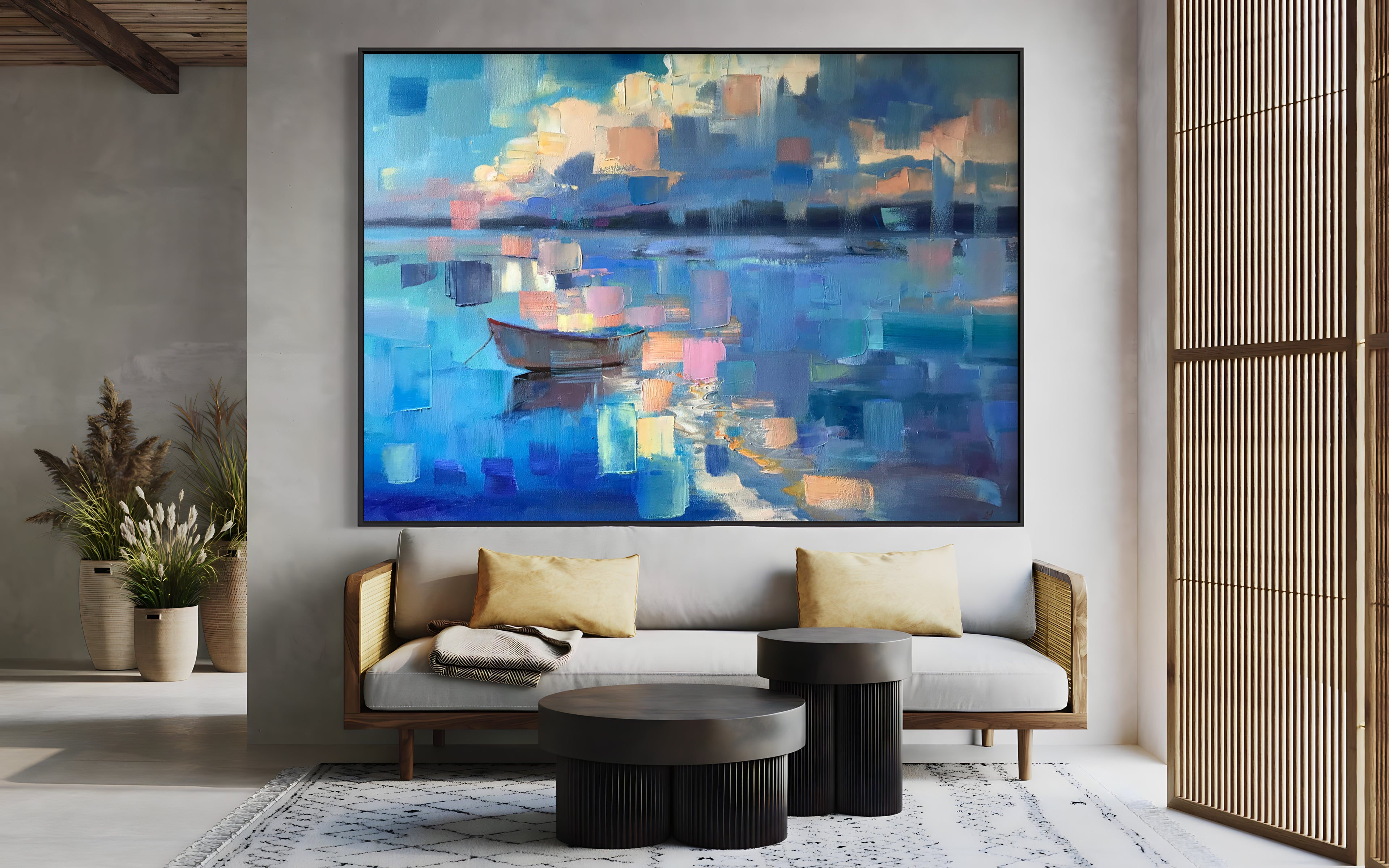 a living room with a couch and a painting on the wall