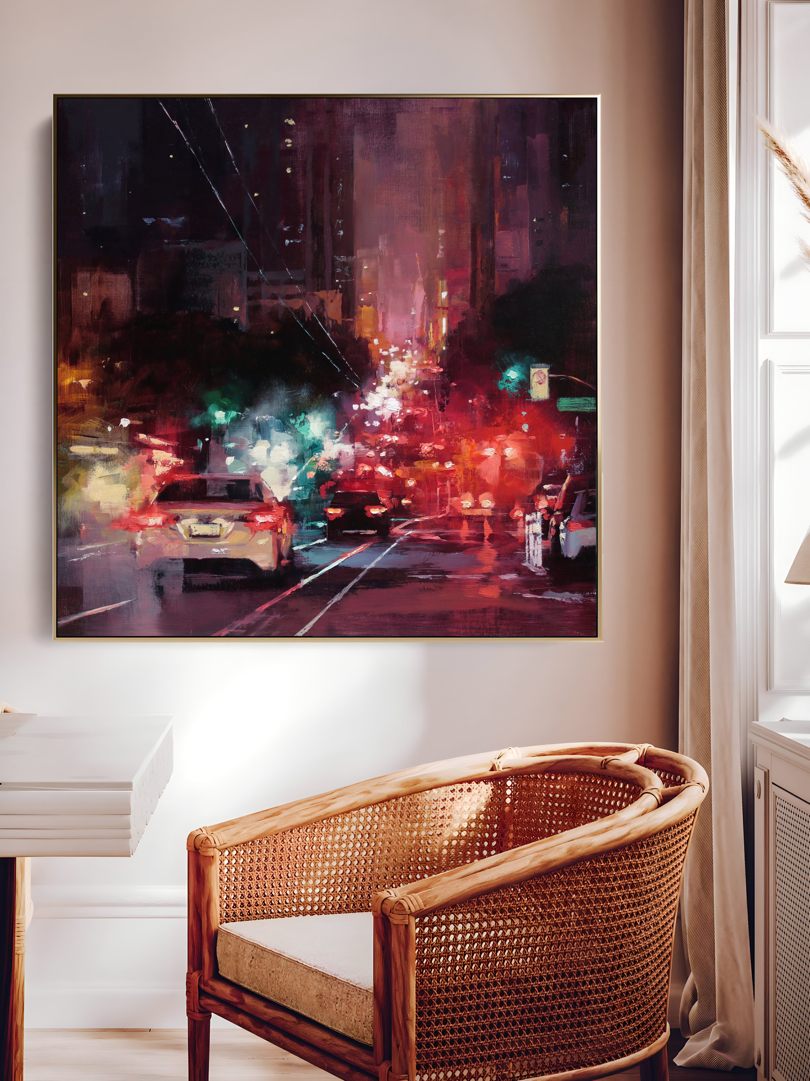 a painting hanging on a wall above a chair