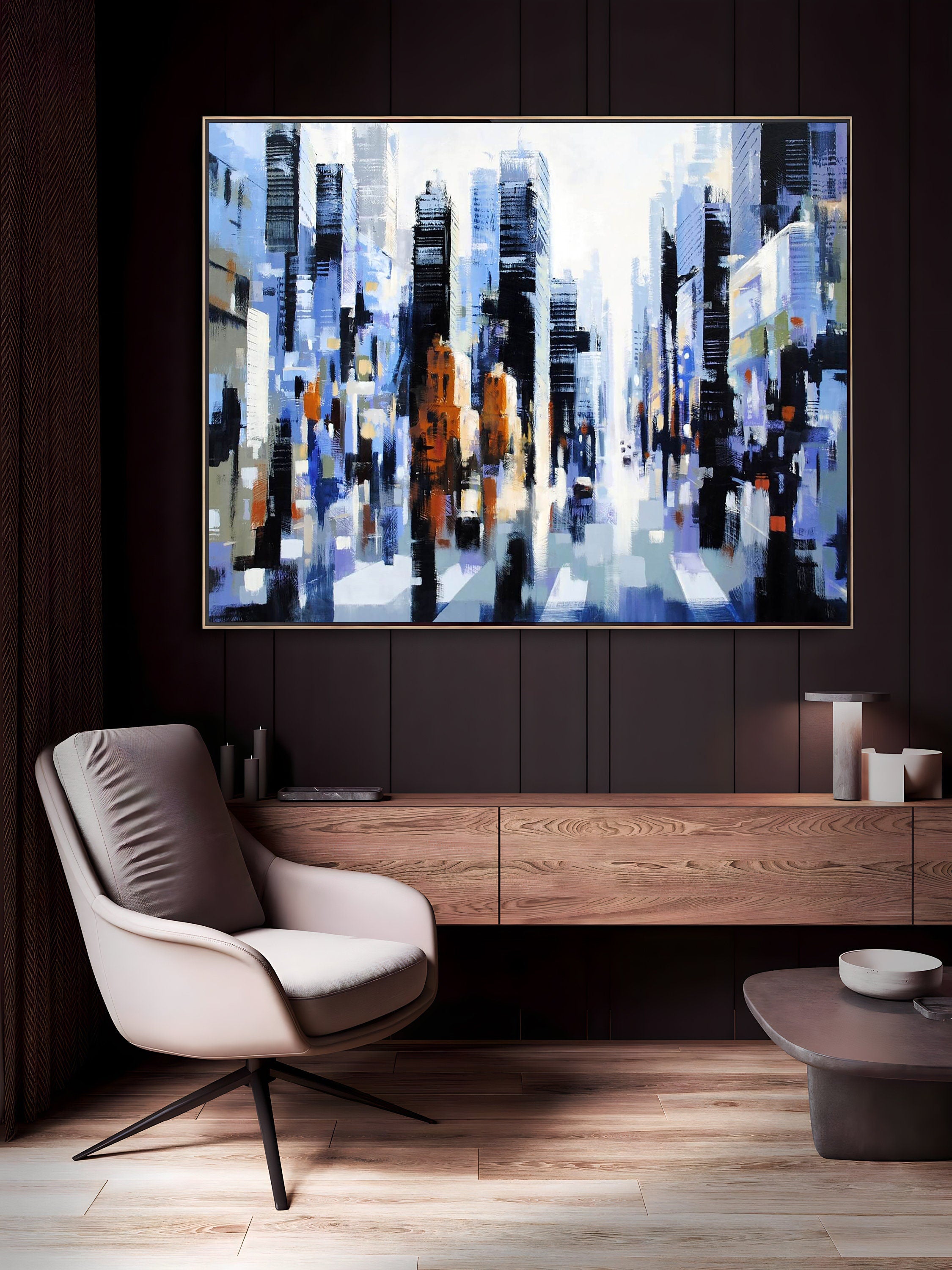 a living room with a painting on the wall