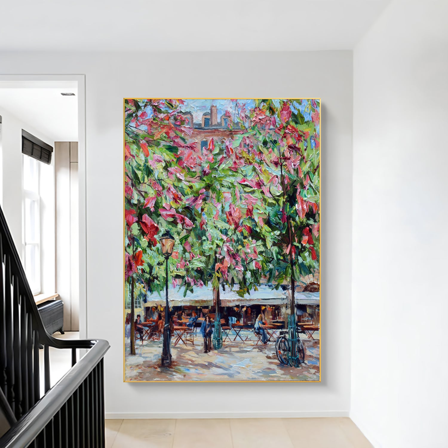 a painting hanging on a wall next to a banister