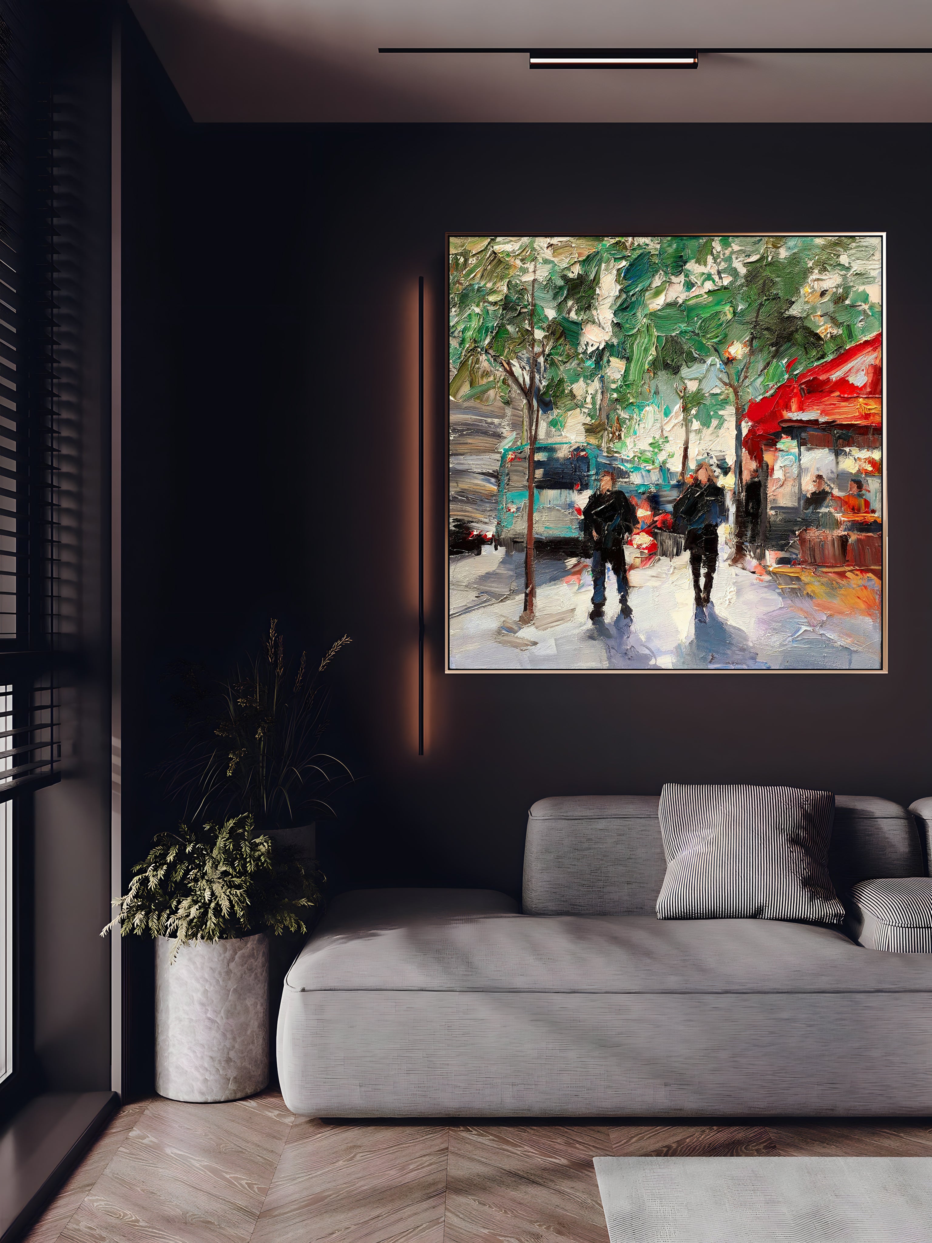 a living room with a couch and a painting on the wall