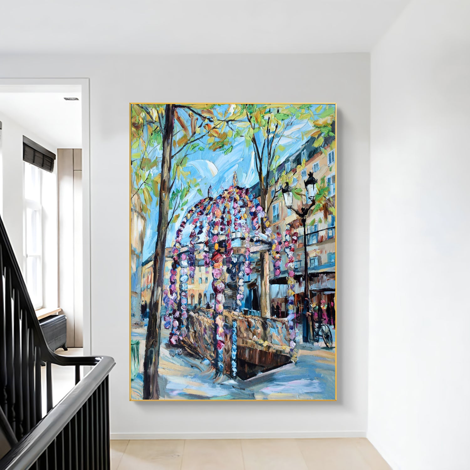 a painting hanging on a wall next to a stair case