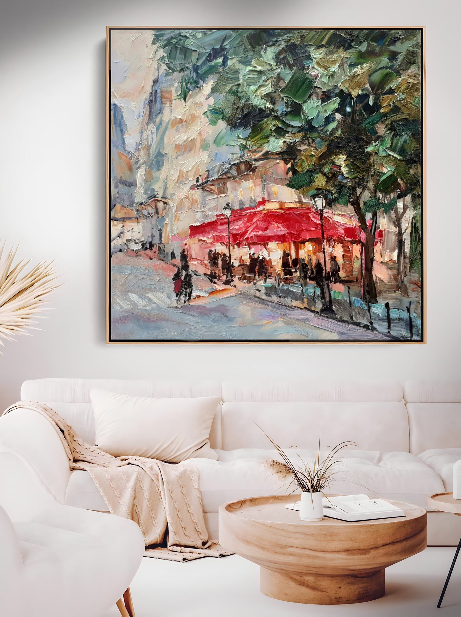 a living room with a couch and a painting on the wall