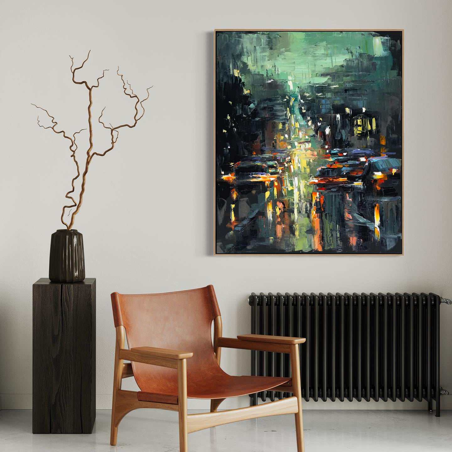 a painting hanging on a wall next to a chair