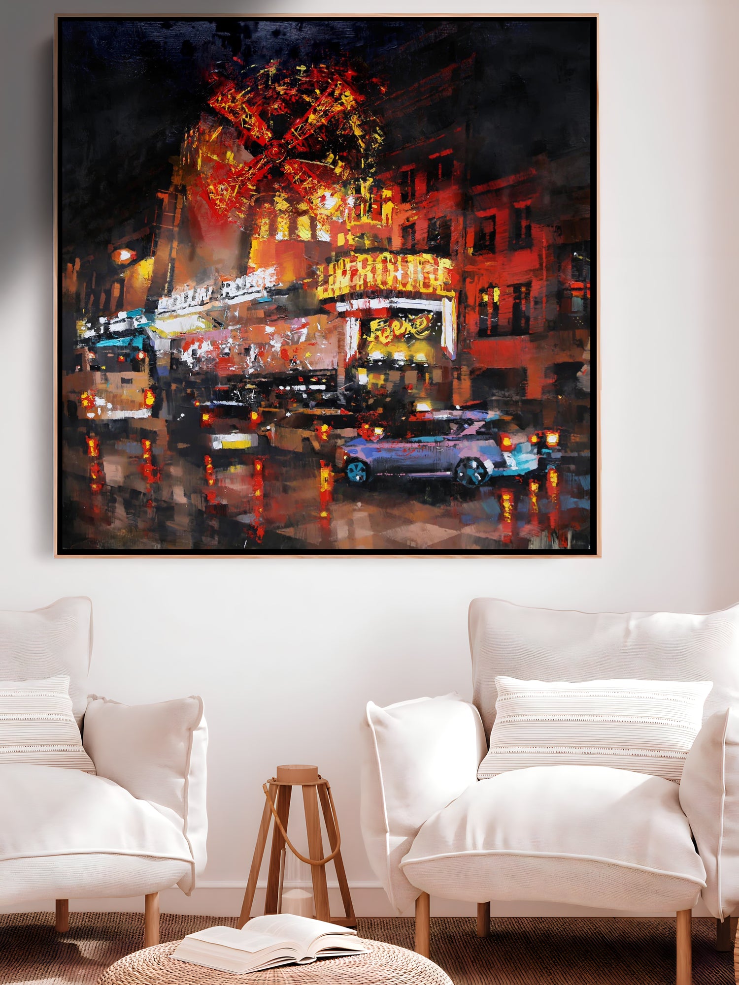 a living room with two chairs and a painting on the wall
