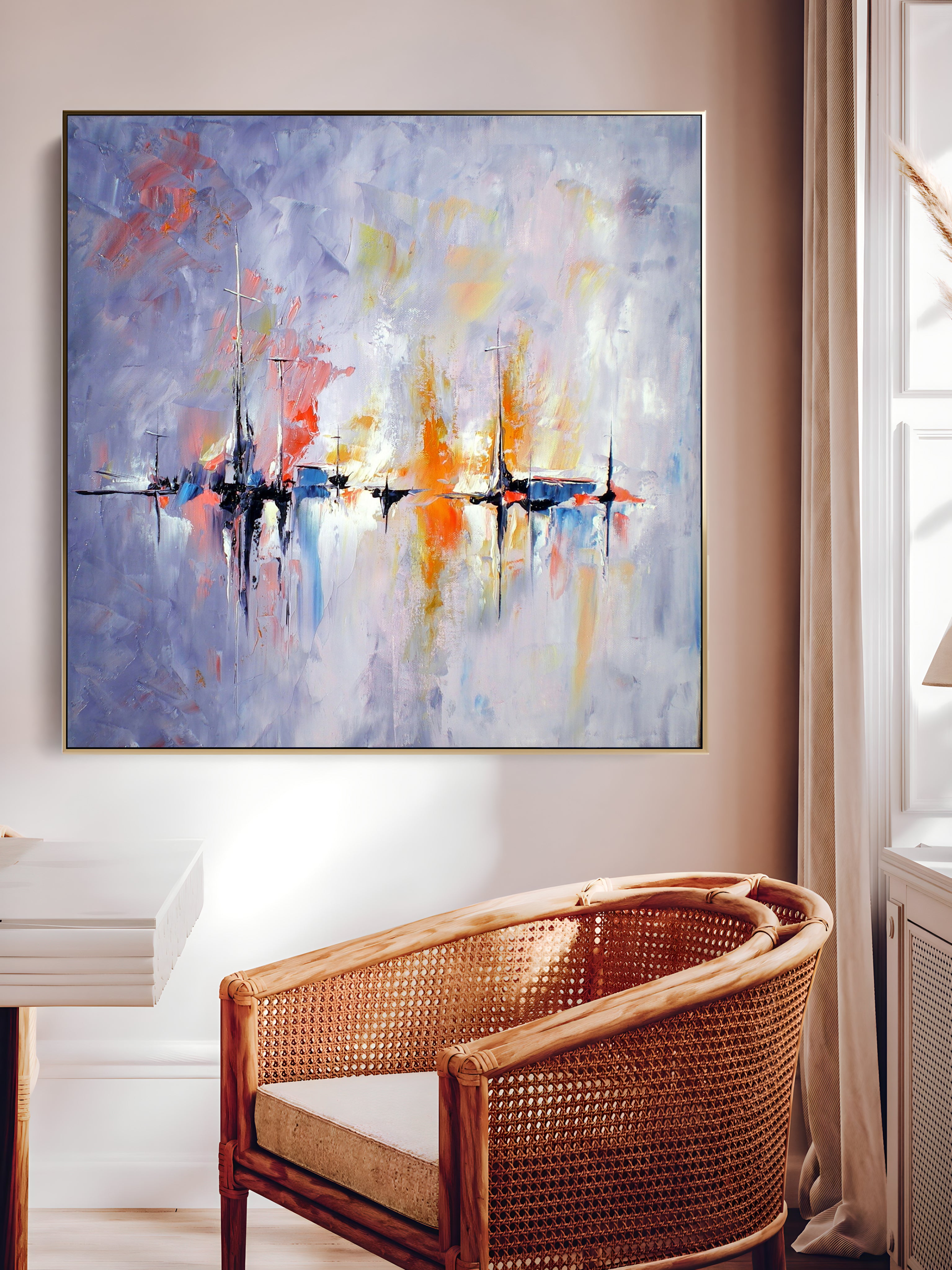 a painting hanging on a wall next to a chair