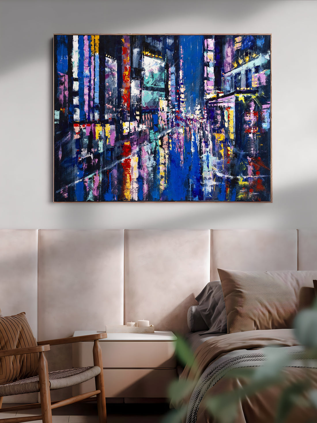 a painting of a cityscape is hanging above a bed