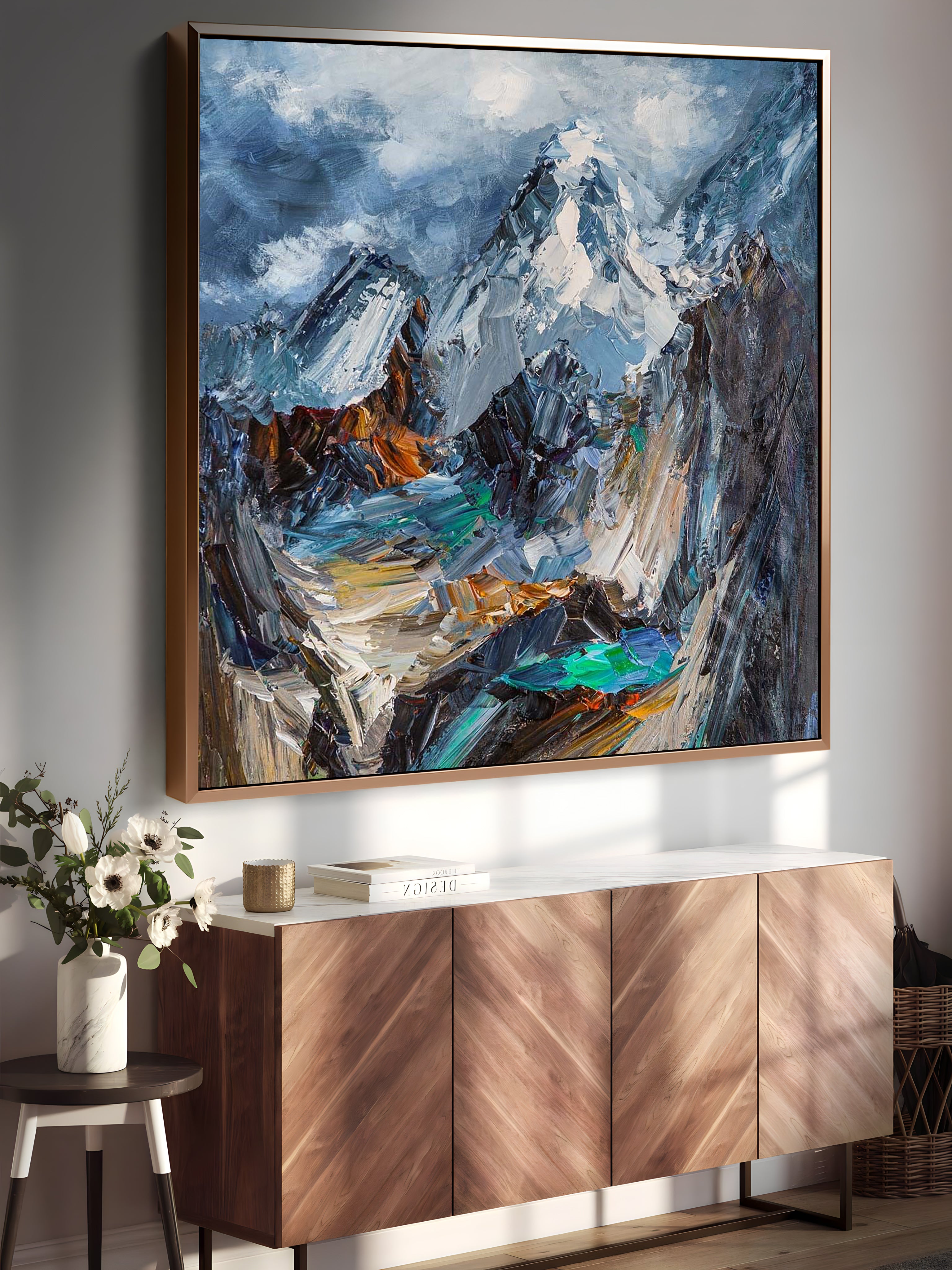 a painting hanging on a wall above a sideboard