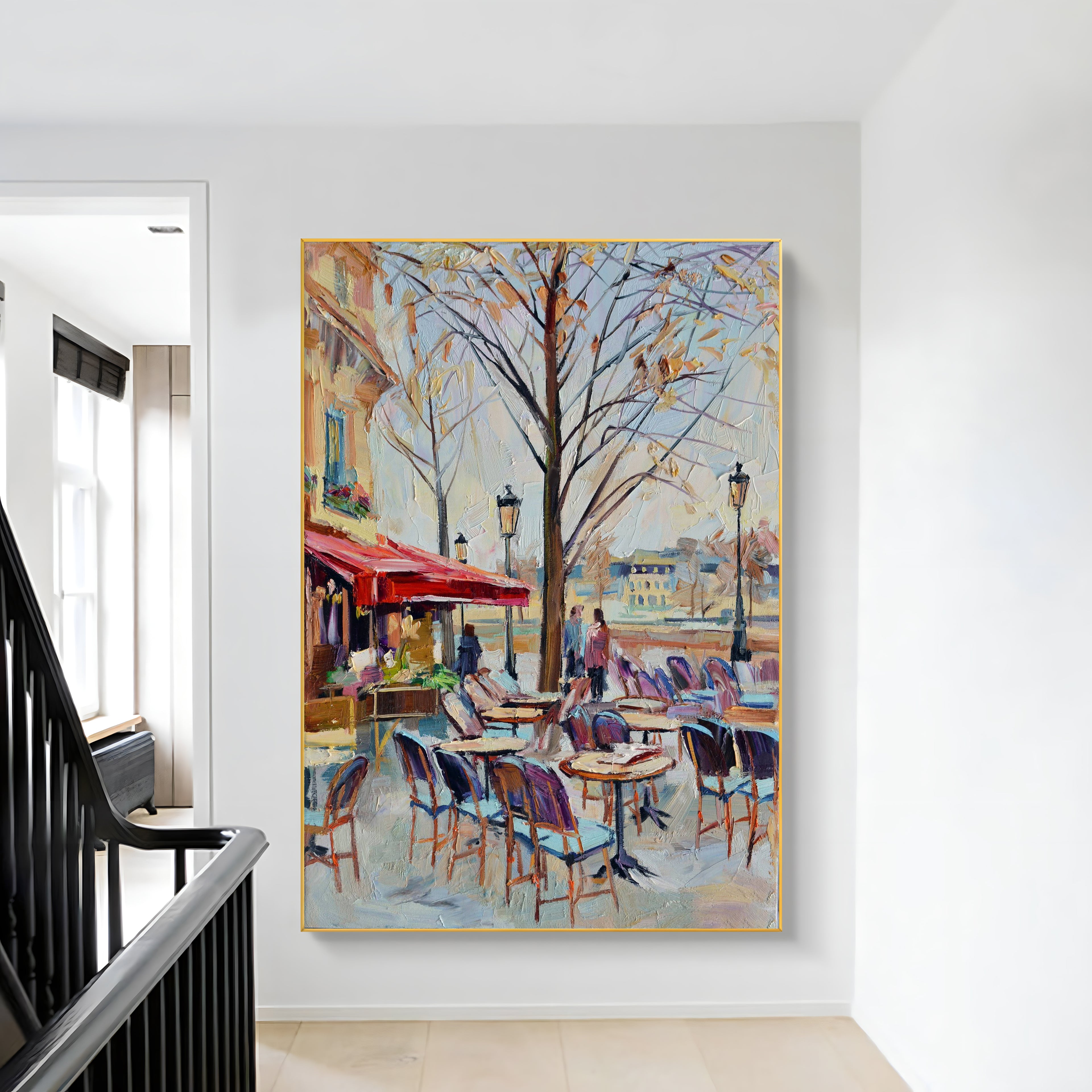 a painting hanging on a wall next to a banister