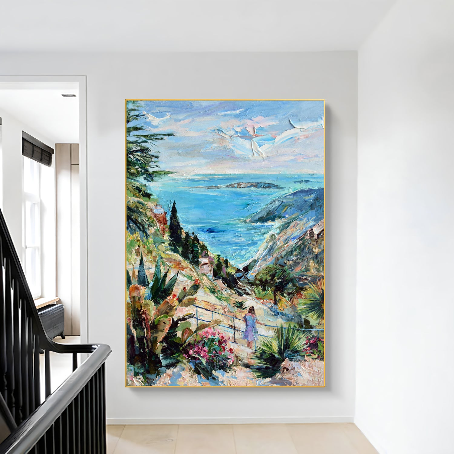 a painting hanging on a wall next to a stair case