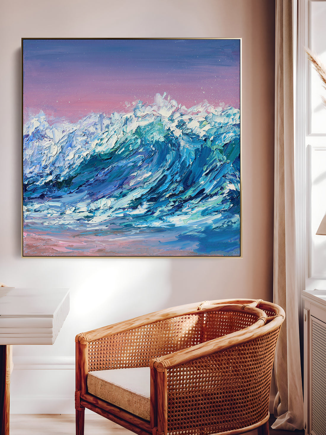 a painting of a wave on a wall above a wicker chair