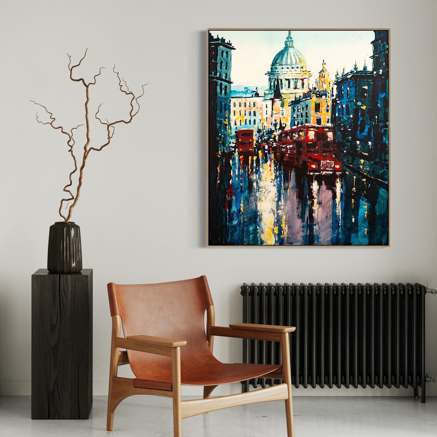 a painting hanging on a wall next to a chair