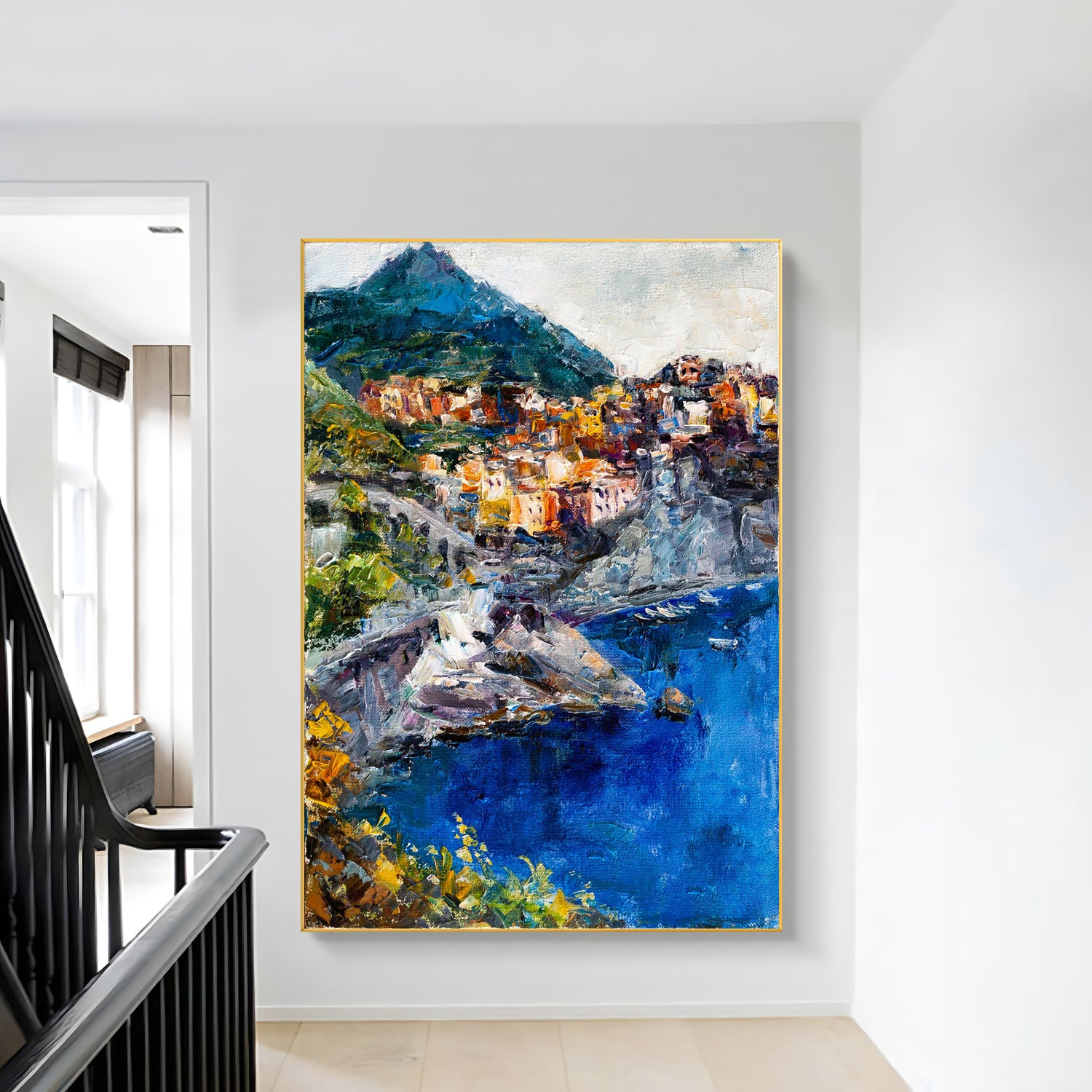 a painting hanging on a wall next to a stair case