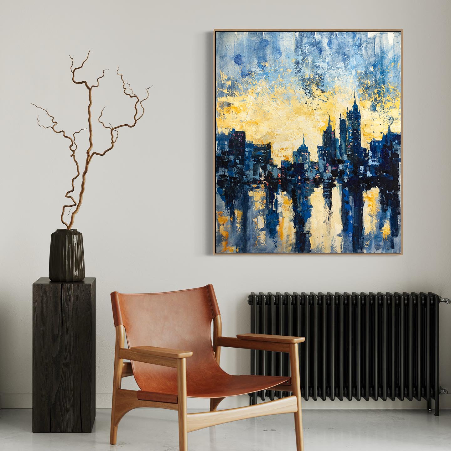 a painting hanging on a wall next to a chair